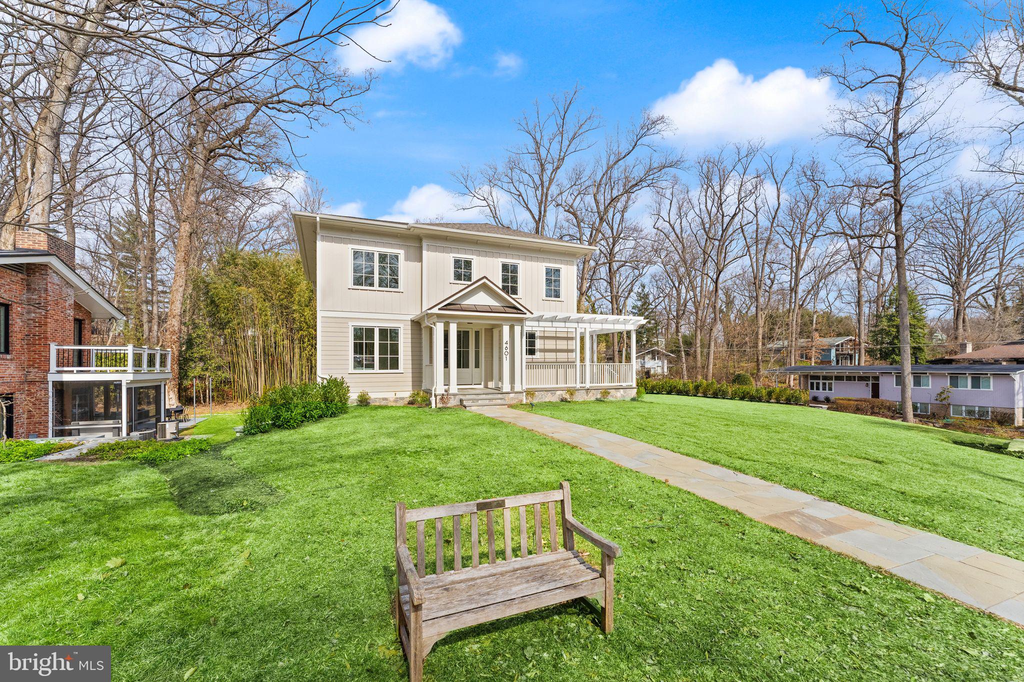 This stunning custom home, crafted by renowned builder Peter Lustig, seamlessly blends modern design with essential amenities. Featuring 5 bedrooms and 4 full baths, this brand-new residence showcases top-tier finishes and meticulous craftsmanship throughout. The kitchen is a chef's dream, equipped with Caesarstone countertops, high-end Jennair appliances, a spacious island, two additional workspaces, a wine fridge, and an expansive pantry. It flows effortlessly into the breakfast room and the elegantly designed family room. An office, dining room, mudroom and large pantry are also found on this level. The home is thoughtfully designed to integrate indoor and outdoor spaces, with large windows and lush, year-round greenery.

The screened porch, complete with ceramic tile flooring and a fireplace, is wired for television, making it an ideal spot for entertaining or relaxing, whether enjoying a movie or the summer breeze. The five bathrooms feature exquisite ceramic tile, custom vanities, and stone countertops. A versatile room on the main level offers the perfect space for an office or an additional bedroom.

Upstairs, wide hallways and natural wood flooring lead to four bedrooms, a lounge, and a laundry room, with each bedroom boasting an en-suite bath. The primary suite is a luxurious retreat with space for a king-sized bed, two walk-in closets, an extra closet, and a primary bath with stunning tile, a separate shower, and an extra-deep soaking tub.

The walk-out lower level is bathed in natural light and includes two entertainment spaces, another bedroom and full bath, a storage room, and a two-car garage equipped with charging capabilities for two vehicles. Situated on a quarter-acre corner lot, the home features a wrap-around porch shaded by a pergola.

Garrett Park is a charming small town nestled in a picturesque setting adjacent to Rock Creek Park in southern Montgomery County, Maryland. Residents enjoy convenient access to Washington DC, thanks to the MARC commuter train station located within the town and the Grosvenor-Strathmore Red Line Metro station just about a mile away.

Established in 1898, Garrett Park boasts an active town government and vibrant community organizations. Designed as an English village, the town features winding, tree-lined streets and a diverse array of housing styles. Recognized on the National Register of Historic Places, Garrett Park is also an Arboretum, with a dedicated committee overseeing the health and diversity of its trees. Notably, in 1962, Garrett Park became the first Nuclear Free Zone in the United States through a town referendum.

At the heart of the community is Penn Place, serving as the town square where residents gather to collect mail (as home delivery is not available) or visit the Town Office. Penn Place is also home to the Black Market Bistro restaurant and Art at Penn Place, a gallery showcasing rotating exhibitions. Every Saturday, the Penn Place parking lot transforms into a bustling farmers market. Garrett Park falls within the Walter Johnson High School cluster, with Garrett Park Elementary School located within the town. The Walter Johnson cluster is part of the esteemed and diverse Montgomery County Public School System.

The town offers a community pool, several small parks, sports fields, and playgrounds, all within walking distance to the Strathmore Hall Concert campus. The Citizens Association, along with other town organizations, hosts a variety of events including a 4th of July parade, films, musical performances, architectural and arboretum tours, and much more.