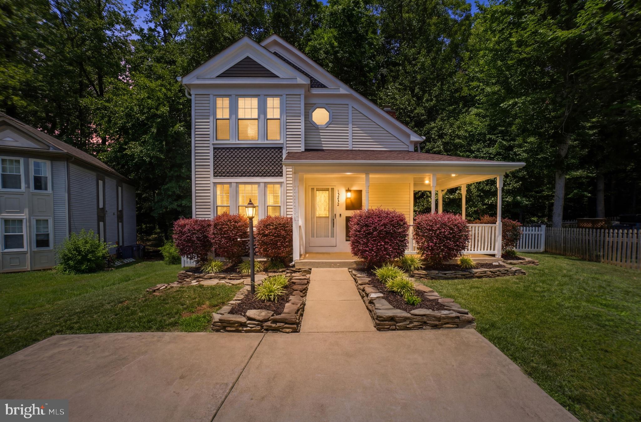 Welcome to this charming Victorian-style single-family home, perfectly situated in the heart of Montclair. From the inviting wraparound porch and classic white picket fence to the private, wooded backyard setting, this home offers character, comfort, and convenience.
Step inside to discover a bright and welcoming interior featuring hardwood floors, vaulted ceilings, and skylights that fill the home with natural light. The thoughtfully designed main level offers the ease of one-level living with a spacious bedroom featuring a full en-suite bathroom, as well as a convenient laundry area.
The family room is highlighted by a stunning stone fireplace with an electric insert, creating a warm and inviting gathering space. The adjoining dining room features sliding glass doors that open to the deck and fully fenced backyard, perfect for entertaining or relaxing outdoors. The spacious kitchen is equipped with granite countertops, stainless steel appliances, and a wine refrigerator.
Upstairs, hardwood floors continue throughout. The primary suite offers a walk-in closet and en-suite full bathroom, while an additional well-appointed bedroom enjoys shared hall access to the full bathroom.
The finished basement provides exceptional versatility with a large recreation room, a fourth bedroom (NTC) with a generous closet, a full bathroom, and abundant storage space.
Enjoy the privacy of the pipestem location and tranquil backyard that backs to mature woods. Ideally located within walking distance of Henderson Elementary School and Kids Dominion Playground, this home also offers access to all that the Montclair community has to offer, including a beautiful lake with three beaches, walking trails, parks, and year-round community events.