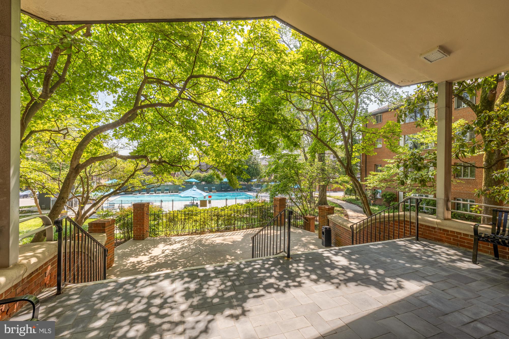 Welcome to Kenwood Place, where timeless comfort, generous living spaces, and one of Bethesda's most exciting emerging neighborhoods come together. Beautifully updated and meticulously maintained, this expansive two-bedroom condominium offers one of the community's largest two-bedroom floor plans with 1,284 square feet of thoughtfully designed living space. Freshly painted throughout and enhanced with stylish new flooring and updated light fixtures, this move-in-ready residence is filled with natural light and an inviting warmth. The oversized living and dining areas provide exceptional flexibility for entertaining, working from home, or simply enjoying everyday life, while two spacious bedrooms offer abundant closet space and comfortable private retreats. The monthly condominium fee delivers exceptional value by covering electricity, gas, heat, water, sewer, trash, exterior maintenance, snow removal, professional management, reserve funds, and access to outstanding community amenities including an outdoor swimming pool, fitness center, beautifully landscaped common grounds, and additional storage. Beyond the front door, enjoy a lifestyle defined by convenience. Just moments away, the newly transformed Westbard Square has become one of Bethesda's newest neighborhood destinations, featuring a vibrant mix of restaurants, cafés, specialty retail, fitness studios, green gathering spaces, and everyday conveniences including Giant, Tatte Bakery & Café, Starbucks, Sense of Thai, Oak Barrel & Vine, Piccoli Piatti Pizzeria, Silver & Sons BBQ, and more—with additional residential, retail, and community enhancements continuing to shape the neighborhood's exciting future. Ideally located just minutes from downtown Bethesda, Friendship Heights, the Capital Crescent Trail, NIH, Walter Reed National Military Medical Center, and Metro, and within the highly sought-after Walt Whitman High School cluster, this exceptional residence offers the perfect blend of space, convenience, and long-term value. Whether you're purchasing your first home, rightsizing, or seeking a smart investment in one of Montgomery County's most desirable locations, this is an opportunity to enjoy effortless living in the heart of Bethesda.