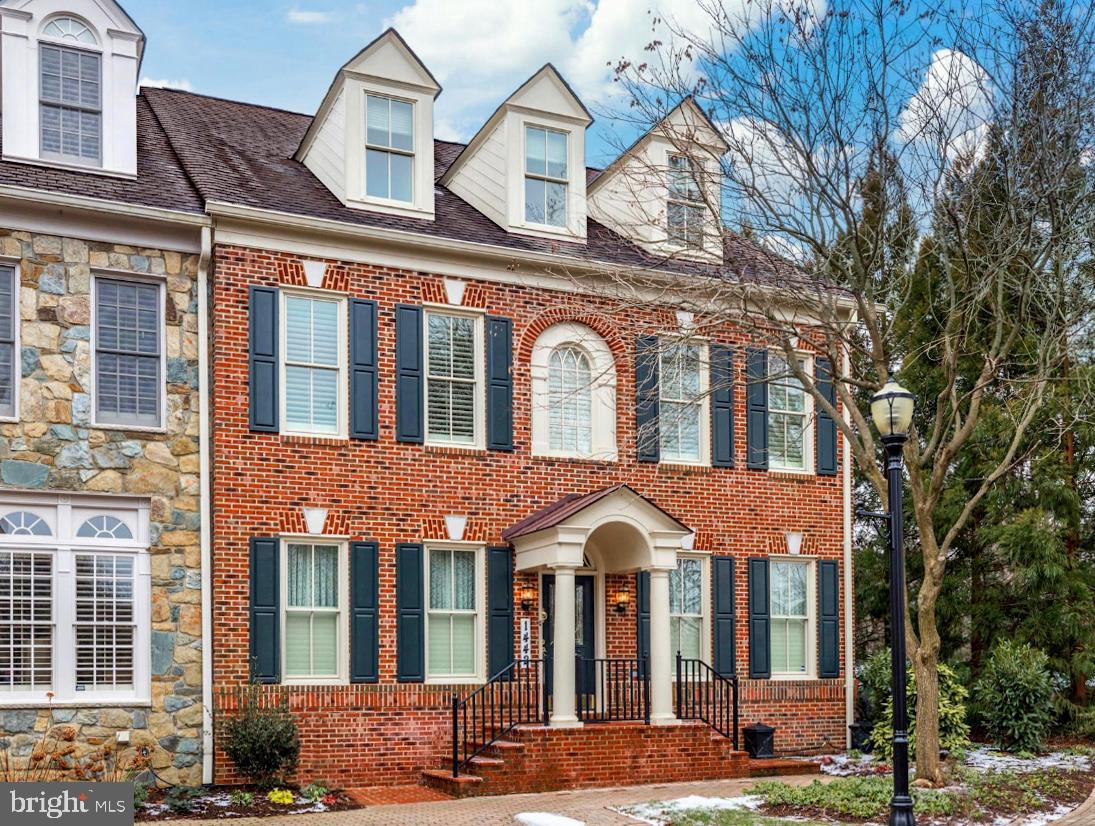 Quietly tucked away in McLean's premiere gated community, this end-unit Albemarle model townhome with an elevator was beautifully renovated in 2016, 2017 and 2019. Renovations included a new gourmet kitchen and butlers pantry along with new secondary baths. Luxury details such as additional crown molding, new and refinished flooring, new carpeting, new windows, custom garage storage, new lighting throughout, and much more.  The formal living, library and dining room frame the home's entry foyer whilst the well-appointed chef's kitchen with impeccable finishes, custom cabinetry, center island, and granite tops anchors the home's breakfast and family room. This open area is warmed by a gas fireplace and flows naturally out to the rear patio. The charming and private paver courtyard with convenient alleyway access was leveled, improved and re-paved in 2019 and includes rebuilt stairs, new exterior lighting, outdoor speakers and grill.  The Albemarle model is a gracious floor plan with generously sized rooms of excellent proportions and large windows that welcome in natural light. The 2-car garage is accessed via the main level: and the upper two levels include four bedrooms, four full baths, storage and a laundry room. The gorgeous luxurious Primary Suite includes an en-suite bath with dual water closets, dual vanities, dual shower heads, dual walk-in closets with custom organizing system, and a serene sitting area with a fireplace which helps to make this space a true retreat. The lower level has a large recreation room, an exercise room, full bath, and a private den that is ideally designed for virtual learning or working from home.   Described by some as "Georgetown except with big closets and parking", the Evans Farm neighborhood was built in the early 2000s on the 25-acre site of the former Evans Farm Inn. It retains the pond, the water mill and mature trees of its origins, along with several pocket parks and thoughtful landscaping. Traditional architectural styles and brick sidewalks provide the feeling of an established neighborhood that includes detached homes, town homes and condos. This gated community is conveniently located close to Tyson's Corner and the Silver Line Metro and is walkable to downtown McLean.