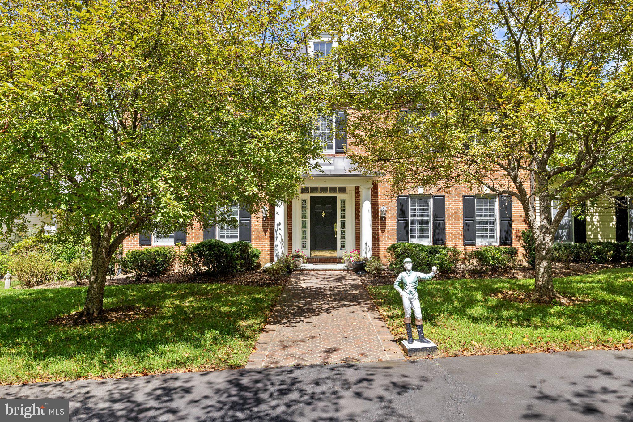 This stunning residence boasts 4 bedrooms , 3 1/2 baths and 3 fireplaces.  Open floor plan, high ceilings and an abundance of natural light.  Gourmet kitchen, top of the line appliances and custom cabinetry.  Fully finished basement and a partially covered rear deck that spans the entire back of the house.  There is a large 2-car attached garage, a detached carriage house with 2 garage spaces.  Fenced in pool with gazebo, mature plantings, fruit trees and a spring fed pond.