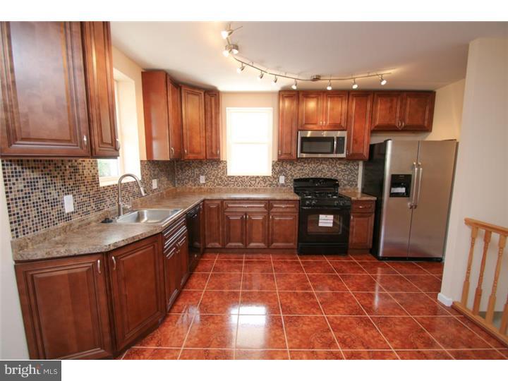 WOW! Look no further, good things come to those who wait! Unbelievable Oak Lane/Olney Home Completely Knocked Out, ready for you to move into! Do you like elegance? Well this home is one of a kind and offers every extra a buyer can want. The entire home has new windows, a new roof w/ warranty, all new siding, updated electric & plumbing, and not to mention all new efficient Heating & AC Units! The 1st floor features a huge open layout with Brazilian Cherry floors, and a unique trey ceiling combo with recessed lighting, a new kitchen, which features GE appliances & self closing cabinets! The upstairs features 4 good sized rooms, and a state of the art spa bath with a Jacuzzi. Other key features include a completely tiled powder room and a full finished walk-out basement for your convenience.  This home truly has it ALL and is a MUST SEE!
