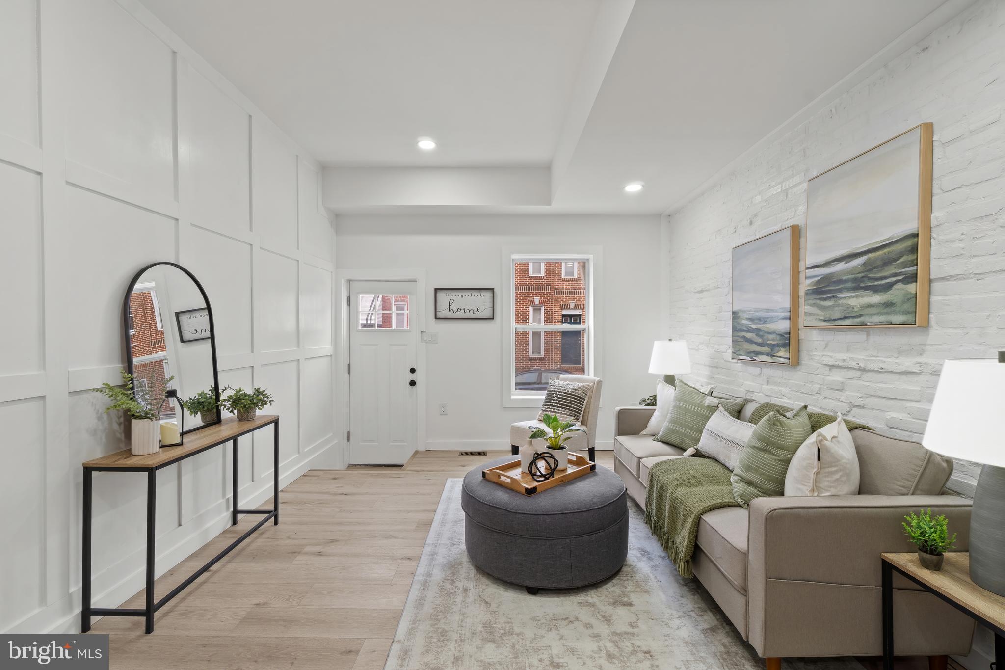 Completely renovated Pigtown townhome on a quiet street—where modern finishes meet worry-free living. This brand-new renovation features all new windows, HVAC, plumbing, electrical, appliances, flooring, and fresh paint throughout, offering true turnkey peace of mind. -The open main level flows effortlessly from living room to kitchen to dining area and is anchored by a stunning, high-end backsplash and sleek finishes that elevate the space.  Upstairs, you’ll find two spacious bedrooms with two full bathrooms and a balcony off of the back bedroom overlooking a field.  The lower level offers generous bonus space—perfect for a workshop, home gym, storage, creative studio, OR A THIRD BEDROOM. -Out back, enjoy a brand-new fenced patio, ideal for relaxing, entertaining, or letting a pet roam—rare and valuable city outdoor space. -Located in vibrant Pigtown, close to parks, dining, stadiums, and major commuter routes, this home delivers style, function, and long-term value in one of Baltimore’s most convenient neighborhoods. -Move in and enjoy—everything is already done.