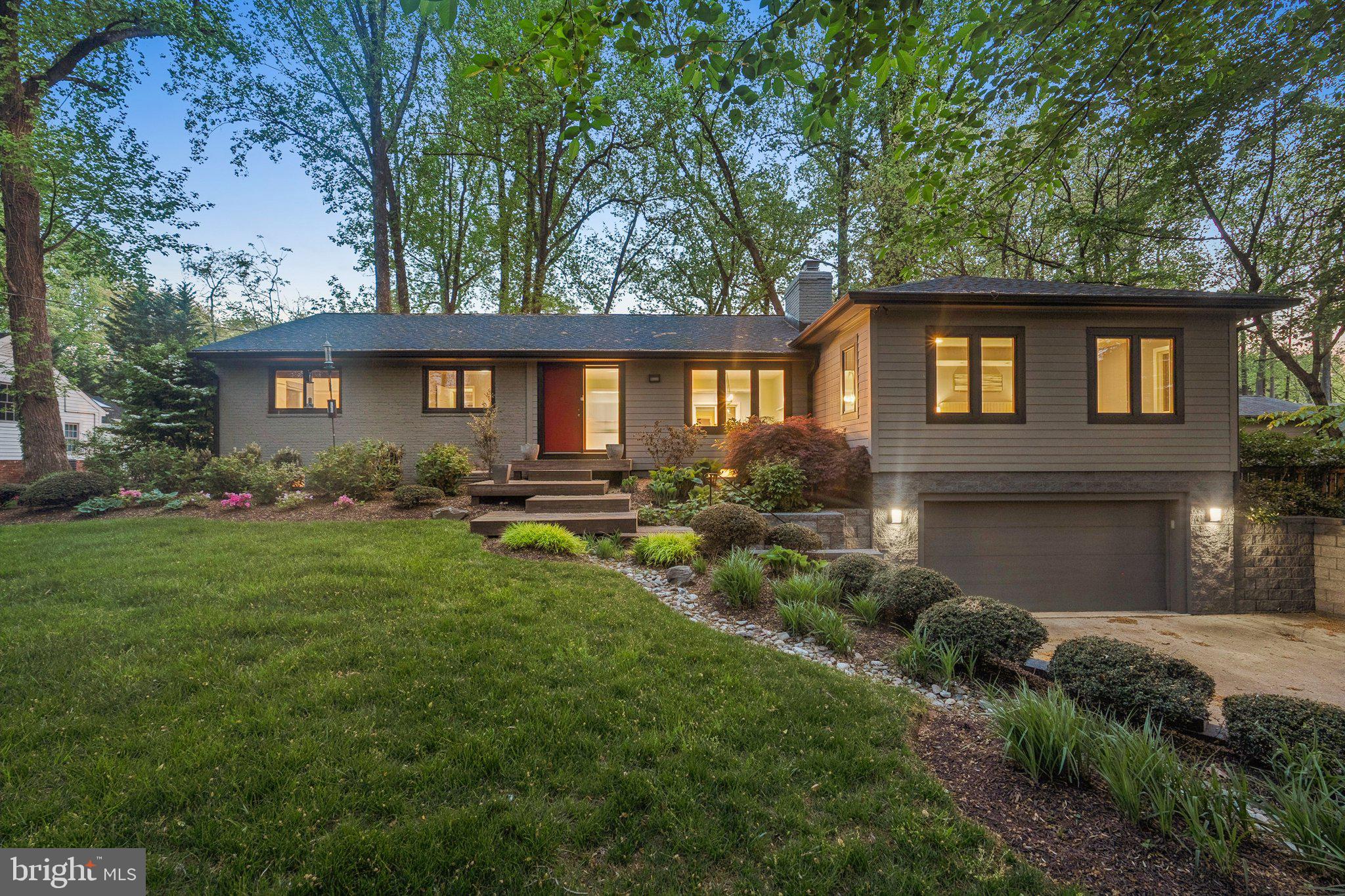 Welcome to 7903 Old Falls Road, situated on a private half-acre in McLean. This meticulously maintained ranch-style residence, built in 1961 and thoughtfully expanded in 2008, offers approximately 3,800 square feet of living space on two levels.

Step inside to freshly painted interiors with hardwood floors and abundant natural light. The spacious living and dining areas, warmed by one of three fireplaces, provide an inviting atmosphere perfect for entertaining. Enjoy the ease of single-level living with four generously sized bedrooms on the main floor. The expansive primary suite offers a walk-in closet, large en-suite bath with dual vanities, and privacy away from the rest of the home. The original side of the home has a second bedroom with an en-suite, and bedrooms 3+4 share a third full bath.

The versatile lower level includes a spacious recreation room with a fireplace, ideal for entertainment or relaxation, along with a fifth bedroom and full bath—perfect as a guest or in-law suite. A dedicated gym could certainly be used as a 6th bedroom with the walk-up stairs as a private exit. There’s ample storage and a laundry room on this level as well.

Outdoors, a large deck overlooks the fully fenced backyard, providing a peaceful, park-like setting surrounded by mature landscaping. Additional amenities include an oversized two-car garage and plenty of driveway parking.

Conveniently located near Tysons Corner’s upscale shopping, dining, and entertainment, this home offers quick access to major routes including I-495, Route 7, the Dulles Toll Road, and the Silver Line Metro.