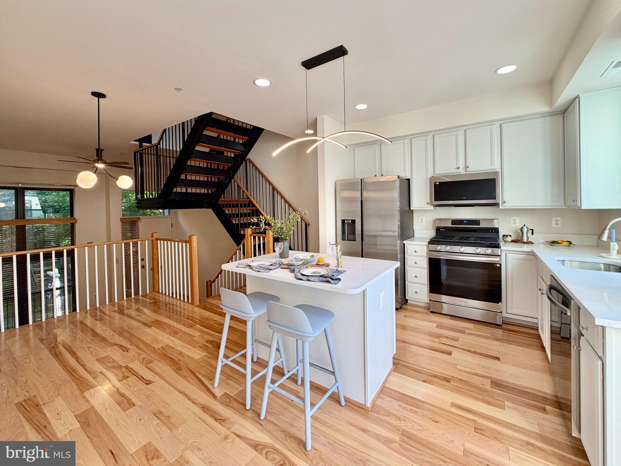 *HOT NEW LISTING!*  TWILIGHT OPEN HOUSE  | WEDNESDAY  5:30-7:00 PM
*RARELY AVAILABLE TOWNHOME IN SOUGHT-AFTER GATED COMMUNITY W/ PRIVATE PARKING* 

This is city living without compromise. Imagine yourself coming home to a stunning, light-filled open floor plan, a newly renovated 2026 gourmet kitchen, and a private outdoor Trex deck. This rarely available townhome is located in a sought-after gated community with your very own two private parking spaces. 

The home features brand-new stainless steel appliances, new quartz countertops, updated fixtures, fresh interior paint and touch-ups throughout, all new toilets, and a refreshed lower-level flex space ideal for a home office, gym, media room, studio, or flexible guest space. Even the attached garage was upgraded with freshly painted walls and a premium epoxy floor finish. 

The open-concept main level flows from the bright kitchen and dining area to the living space and newly rebuilt private Trex deck, creating easy indoor-outdoor living. Floating staircases, soaring ceilings, oversized windows, and a top-floor skylight add architectural drama and beautiful natural light throughout. 

The top-floor primary suite offers an en-suite bath and a private retreat-like setting, while two additional bedrooms provide comfortable flexibility. A true city bonus: an attached garage plus an additional driveway parking space. 

With a remarkably low HOA fee of just $65/month and Penn Station only 1.5 blocks away, experience the convenience of living steps from MARC, Amtrak, MICA, Johns Hopkins, restaurants, galleries, and the creative energy that defines Station North. 
Schedule your showing today. (Front pedestrian gate access is from N Calvert St; rear gate is on Hargrove St, where the resident driveway access is also located. Hargrove St is accessible via E Lafayette Ave or E Lanvale St.)