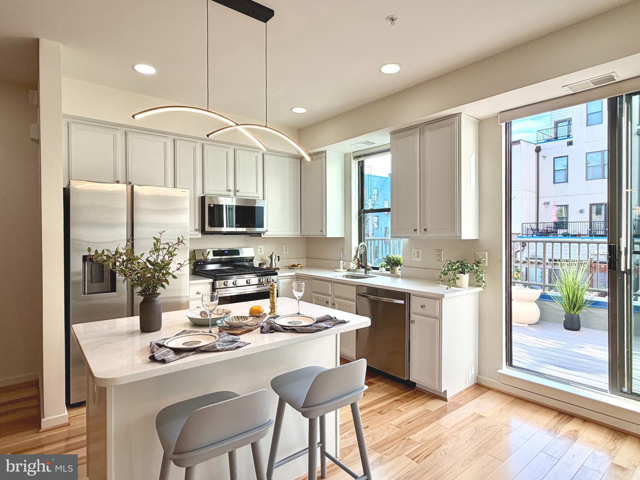 This is city living without compromise.
Located within one of Baltimore City's rare private gated communities, 120 Station North Mews offers a combination rarely found in the city: contemporary architecture, exceptional privacy, extensive 2026 updates, two private parking spaces, and true urban convenience in the heart of Station North Arts District.
The home features a renovated kitchen with brand-new stainless steel appliances, new quartz surfaces, updated fixtures, fresh interior repainting and touch-ups throughout, all new toilets, and a refreshed lower-level flex space ideal for a home office, gym, media room, studio, or guest suite. Even the attached garage was upgraded with freshly painted walls and a premium epoxy floor finish.
The open-concept main level flows from the bright kitchen and dining area to the living space and newly rebuilt private Trex deck, creating easy indoor-outdoor living. Dramatic floating staircases, soaring ceilings, oversized windows, and a top-floor skylight bring in beautiful natural light and give the home a distinct contemporary feel.
The top-floor primary suite offers an en-suite bath and a private retreat-like setting, while two additional bedrooms provide comfortable flexibility. A standout city advantage: an attached garage plus an additional  driveway parking space within a secure gated community.
With a remarkably low HOA fee of just $65/month and Penn Station only 1.5 blocks away, experience the convenience of living steps from MARC, Amtrak, MICA, Johns Hopkins, restaurants, galleries, and the creative energy that defines Station North.
Schedule your showing today.