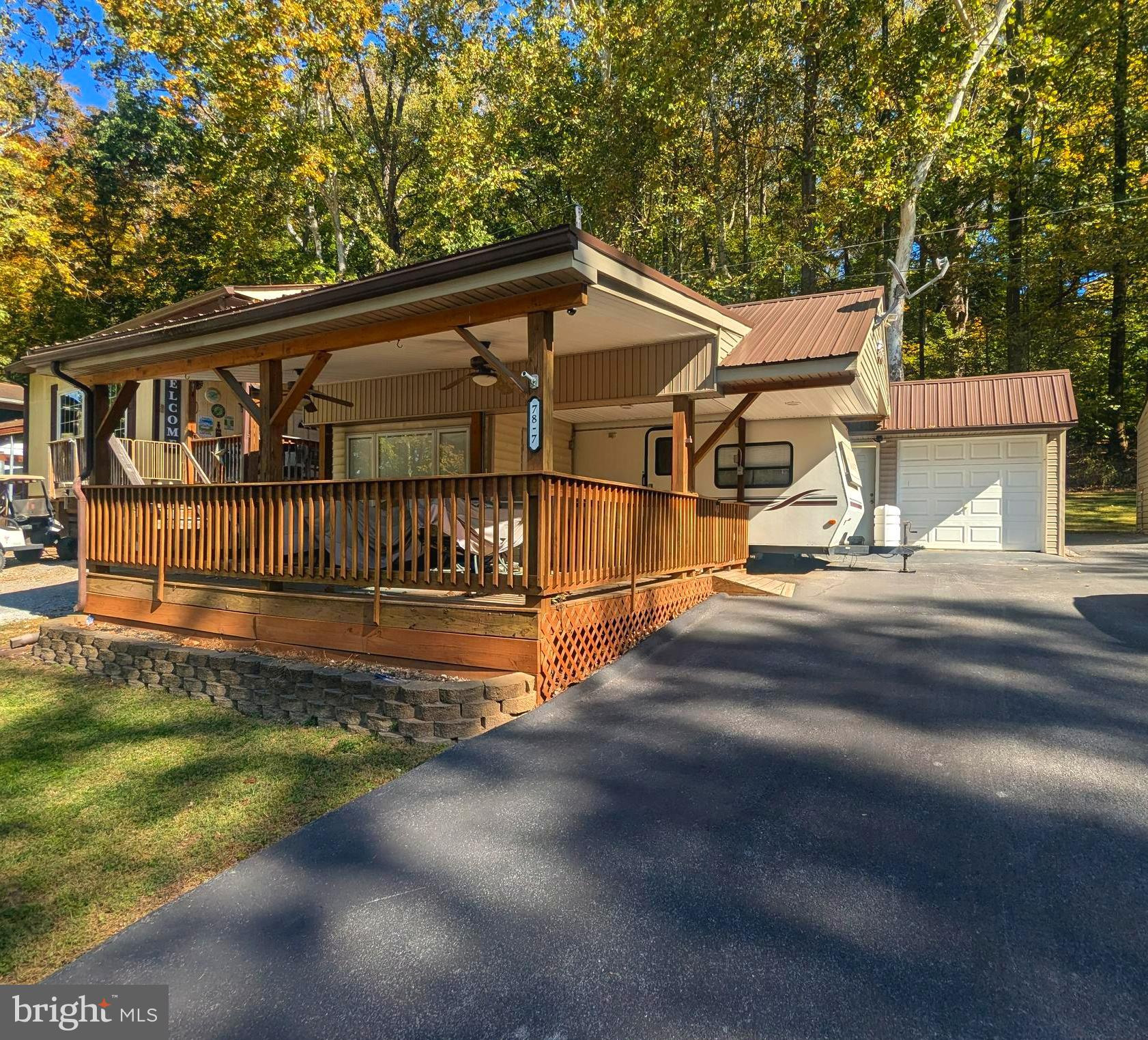 This is a gated community so you need to enter at the guard shack. Entry is not permitted without ID per the office rules. Bring ID's to the office or guard shack for visitor pass. THIS IS A SEASONAL CAMPGROUND! OPEN FROM APRIL 1 TO NOVEMBER 1. ** WELCOME TO RIVER BEND/SEASONAL LOT AVAILABLE TURN KEY** River Bend is a privately owned 400 acre recreational- vehicle camp resort with seasonal activities for members, families and guests. This great RV park is tucked away on the Upper Potomac River of West Virginia, River Bend is one of West Virginia's most popular family seasonal destinations. . Just a short drive from the Washington and Baltimore metro area. Open with utilities from April 1 to November 1. Lot owners have access to their property the entire year. *** Members Enjoy *** * Amazing views and wildlife, Potomac River access, Trails, Swimming pools, Mini-Golf, Youth center, Tennis and basketball courts, laundry facilities, convenience store, deli and lounge. *Bath houses through out the park, boat ramp, bar and grill and even a church located on the grounds. River Bend also hosts numerous activities such as 4th of July fire works, small carnival, bonfires, poker runs, horse shoe tournaments, car show, Halloween Trick or Treat and so much more. ***Property Details *** This lot comes with 1999 
 Citation 27' travel camper with added bonus room.  This camper has a dinette area that folds down to a bed and a couch that can turn into a jack knife bed for extra sleeping areas.   This camper is covered with a pavilion with a metal roof and a shed to store any extra belongings.  All you need is to bring your personal belongings and live the river life.     Great long lot with a grassy area in the back to walk your fur baby's.    Lot has asphalt and a great front yard area with a fire pit .  Come and check out this amazing lot **** Lets bring an offer to to table! ***BRING YOUR BEST OFFER*** YOU WON'T WANT TO MISS THIS ONE.***
This lot also has two more lots on each side of this lot that are for sale so you can bring the entire family. Block 78 Lot 8.