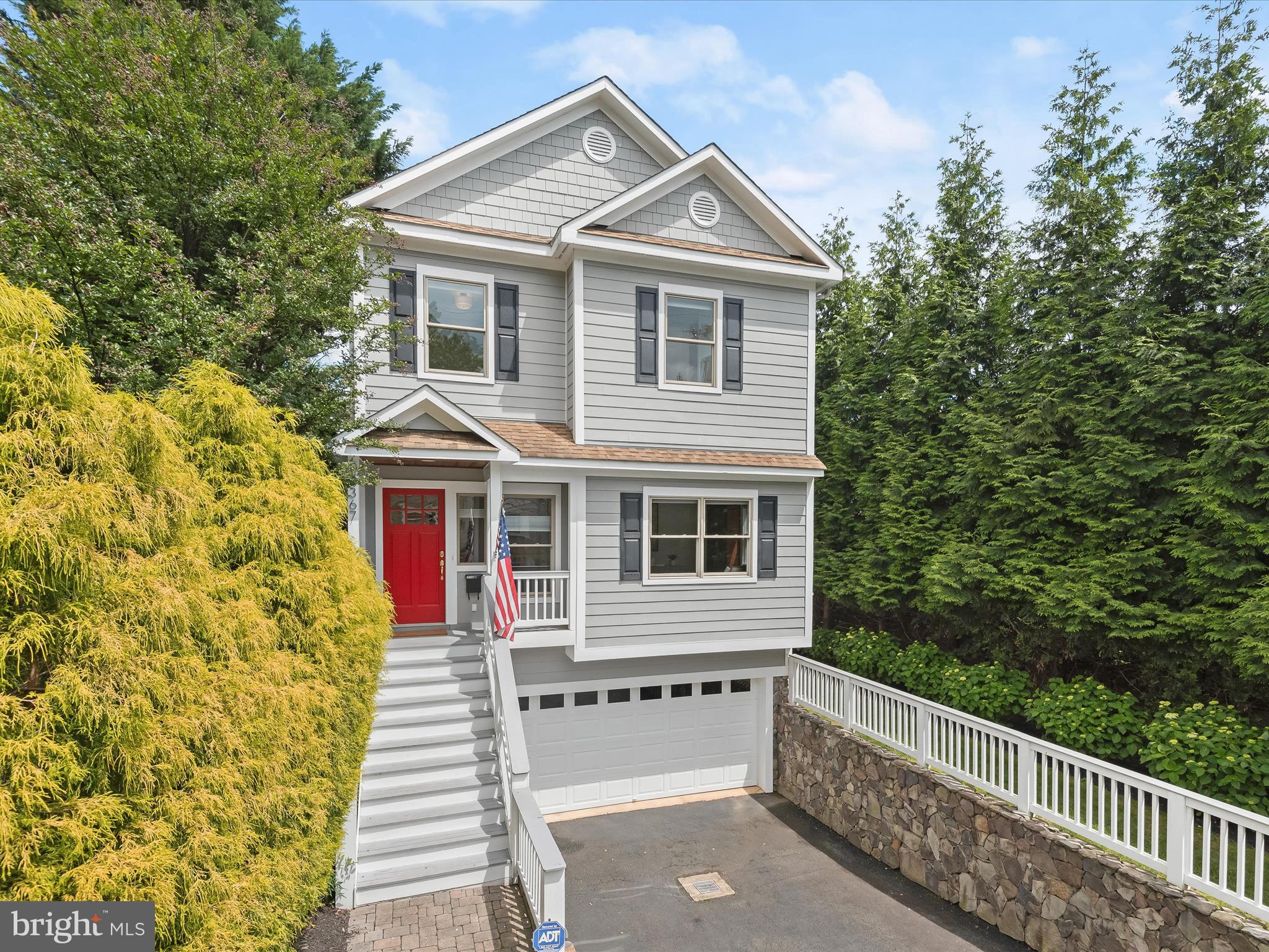 *Newly Listed & Open Sat 1-3pm* . Step into 2367 N Edgewood St, a Modern Coastal Craftsman  blending timeless elements with contemporary comforts, setting the stage for cherished family moments or a relaxing place to come home to. Crafted in 2004, this classic home spans over 4700 square feet across three levels, boasting 5 bedrooms and 4.5 baths.
On the main level, a gracious foyer welcomes you, leading to a front office, formal living and dining spaces, and a butler's pantry guiding the way to the gourmet kitchen with an inviting island, seamlessly flowing into the family room adorned with a cozy gas fireplace. Step outside onto the expansive deck, offering serene views of the lush, private and fully fenced rear yard—a perfect retreat for relaxation and entertainment.
Ascending to the second level, discover the luxurious primary suite featuring a tray ceiling, a generously sized walk-in closet, and a contemporary ensuite bath boasting double sinks, a glass shower, and a soothing soaking tub. Three additional bedrooms, two full baths, and a convenient laundry room complete this level.
The lower level unfolds into a haven of leisure, housing the fifth bedroom, a spacious rec room, and a gaming area complemented by a wet bar. A fourth full bath, utility/storage room, and a mudroom accessible from the two-car garage add to the functionality of this level. Throughout the home, hardwood floors, custom window treatments, and modern lighting accents compliments the classic style.
Conveniently situated in the coveted Woodmont Neighborhood, with swift access to DC via only one traffic light, and proximity to the GW Parkway, Georgetown, Tysons, and three airports, this residence epitomizes urban convenience. Zoned for a sought after school tier to include Taylor ES, Dorothy Hamm MS, and Yorktown HS. Take the path for a short walk or bike ride to Starbucks & Italian Store and less than a mile to Georgetown on the path. Located in Woodmont are two parks, YMCA Gymnastic Center and a beautiful walking trail in the Historic Fort C.F. Smith Park.