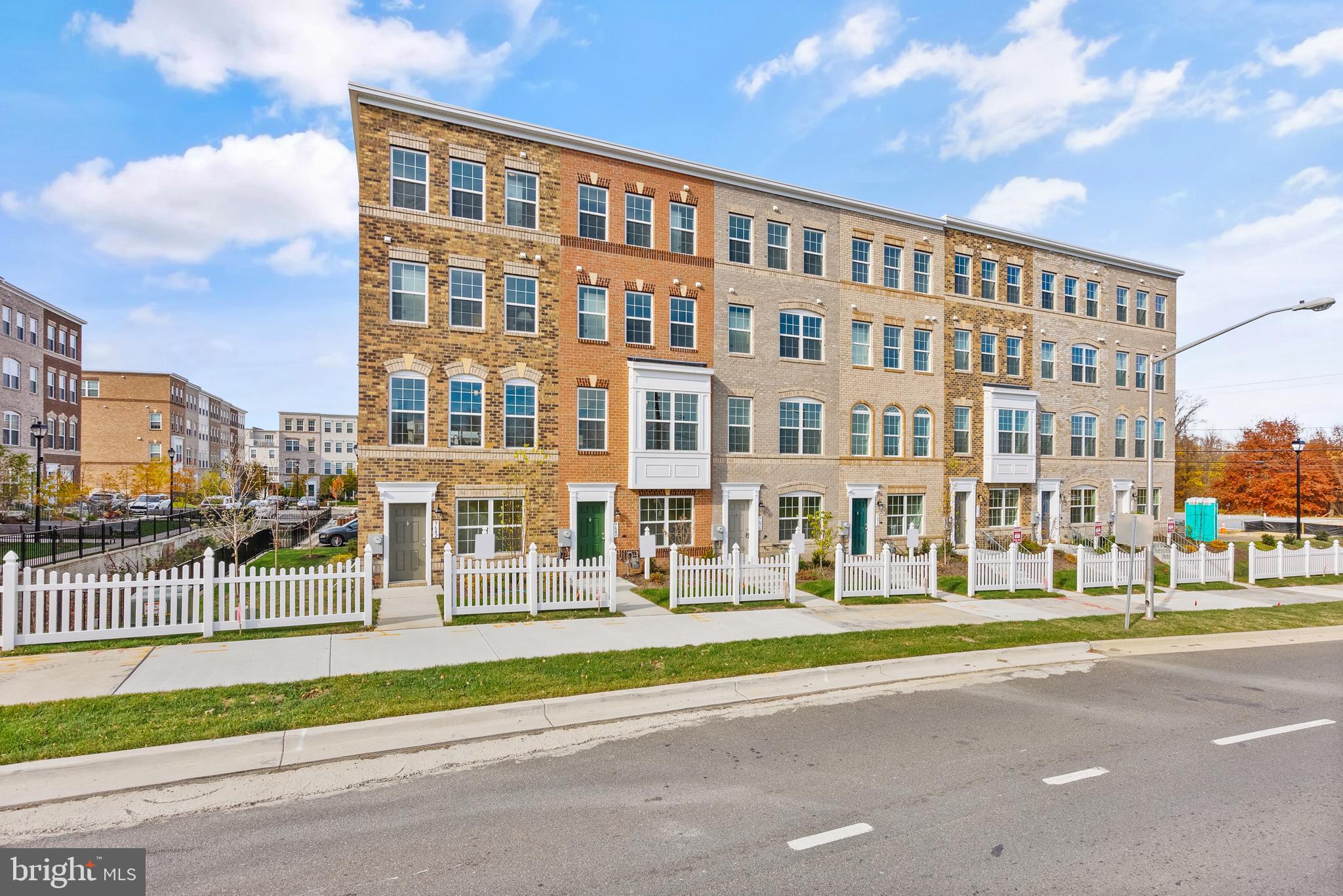 IMMEDIATE OCCUPANCY** – BRAND NEW-NEVER LIVED IN-Stunning End-Unit, 4-Level Full Brick Urban Townhome with a 2-Car Garage. The luxurious **Skytowns 42 Model** includes upgraded flooring throughout the main level, a composite deck, and a rooftop terrace perfect for entertaining. Interior features include a spacious 10-foot kitchen island, cozy fireplace, soaking tub in the owner’s suite, dual walk-in closets, and 3 bedrooms with 3 full and 1 half baths. Gourmet kitchen with stainless steel appliances, quartz countertops, 5-burner cooktop, and double wall ovens. Beautiful ceramic tile baths and upgraded cabinetry with crown molding complete the refined design.  Applicants must meet standard credit and financial requirements, including demonstrating sufficient income, creditworthiness, and financial reserves. All applications will be reviewed once submitted via RentSpree. 1 Months Security Deposit due at initial lease signing.