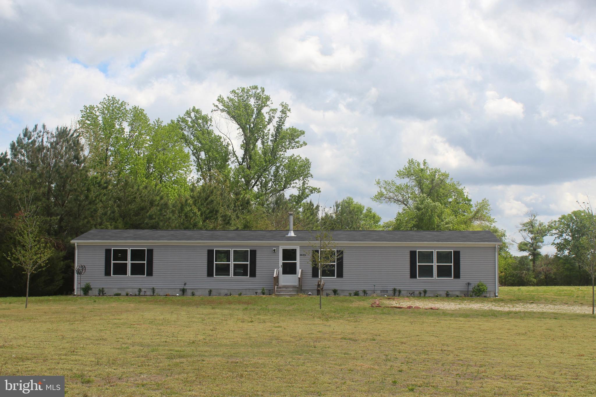 Welcome to your private slice of Eastern Shore living in Goldsboro. Set on 4.7 secluded acres, this 2022-built home offers the space, comfort, and modern features today’s market demands. With over 2,100 square feet, 4 bedrooms, and 2 full baths, the layout is open, bright, and designed for seamless everyday living.

Step inside to a spacious floor plan that flows effortlessly from room to room—ideal for gathering, relaxing, or enjoying the serene environment. The newer construction offers modern systems and contemporary finishes without the wait of a new build.

Outside, the wide-open acreage invites you to create your own vision—whether that includes a garden, hobby space, or custom outdoor entertaining area. Tucked away in a serene setting, yet within reach of nearby towns and conveniences, this property offers a rare balance of privacy and accessibility.

For those seeking newer construction with significant acreage and room to grow, this is an opportunity worth seeing. Schedule your tour today to experience this property in person.
