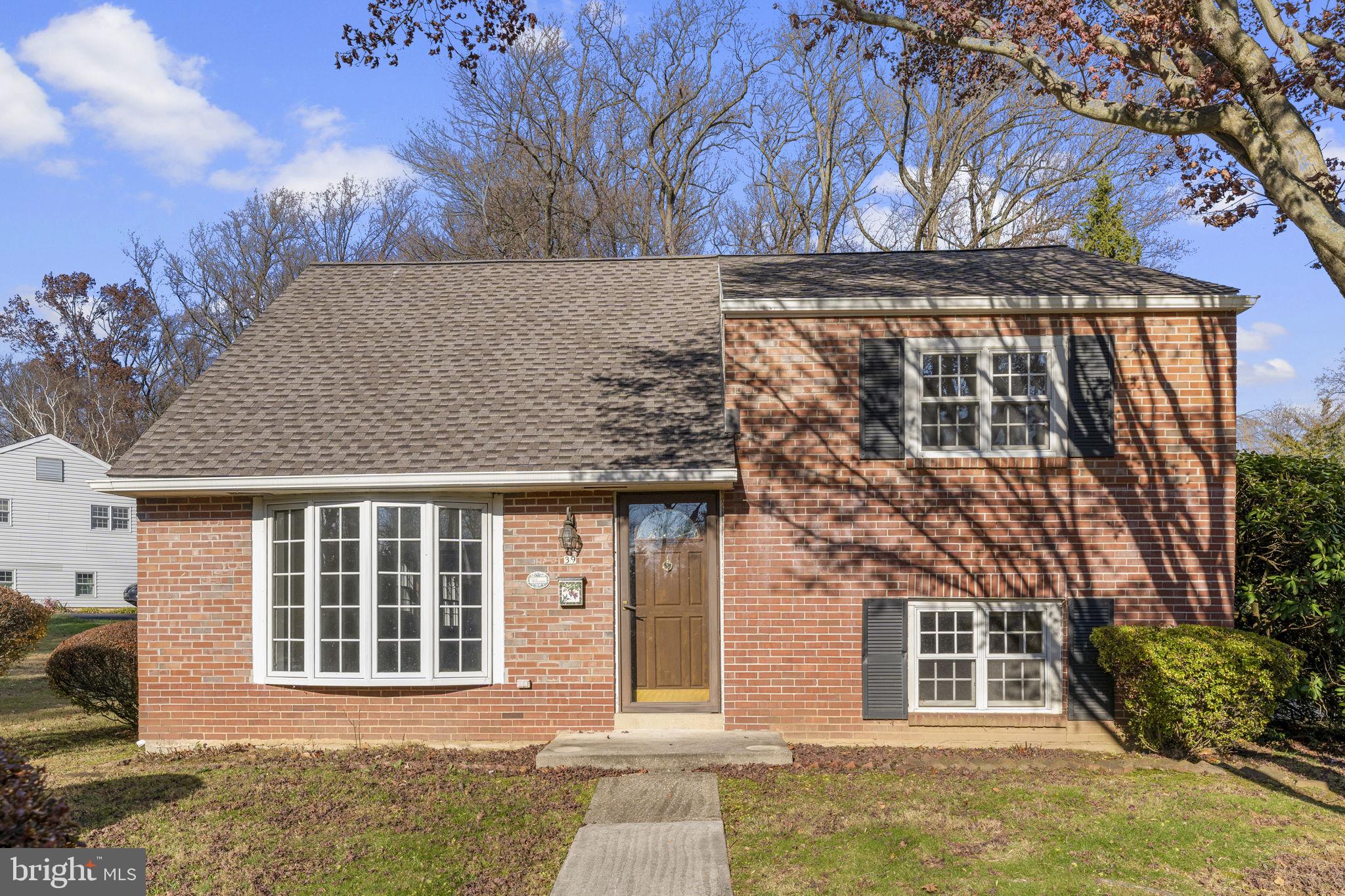 Available immediately! The sellers heard your feedback and have exposed the beautiful hardwood floors in most of this home, installed new carpeting in the remainder of the rooms as well as fresh paint in the family room.  Welcome to 39 Greentree Lane! This expanded, brick-front, split-level home is situated on a large, flat lot in the popular Greentree neighborhood. With quiet streets, it’s great for an evening stroll or a quick and easy walk to Greentree Park. Enter into the living room with bow window looking out over the spacious front yard. Adjacent to the living room is the eating area that’s open to the kitchen with electric cooking. The back of the house has been expanded with a large den with vaulted ceilings with skylights and exposed beams. The focal point of the room is the exposed brick rear wall with a wood burning fireplace. For convenience, there is a full bathroom with a single vanity and a step-in shower plus a large storage closet. Continuing through you’ll find the three-season room with plenty of windows plus a sliding glass door to access the driveway, detached 2-car garage and the backyard. Back inside, the lower level offers more casual space that would be a great home office or playroom. The laundry room and mechanicals are also on the lower level. Upstairs, the second level offers two bright, sunny bedrooms and the second full bathroom with an oversized single vanity and tub/shower combination. The third bedroom is on its own level and includes a walk-in closet and access to the unfinished attic. In addition to being in award-winning Great Valley School District, this home has easy access to both Paoli's Rte 30 shopping, restaurants and the train station with Septa access to Philadelphia and Amtrak access to New York AND Malvern Borough’s boutique shops, local cafes and the train. This is a great opportunity to own a lot of house in a really great location!