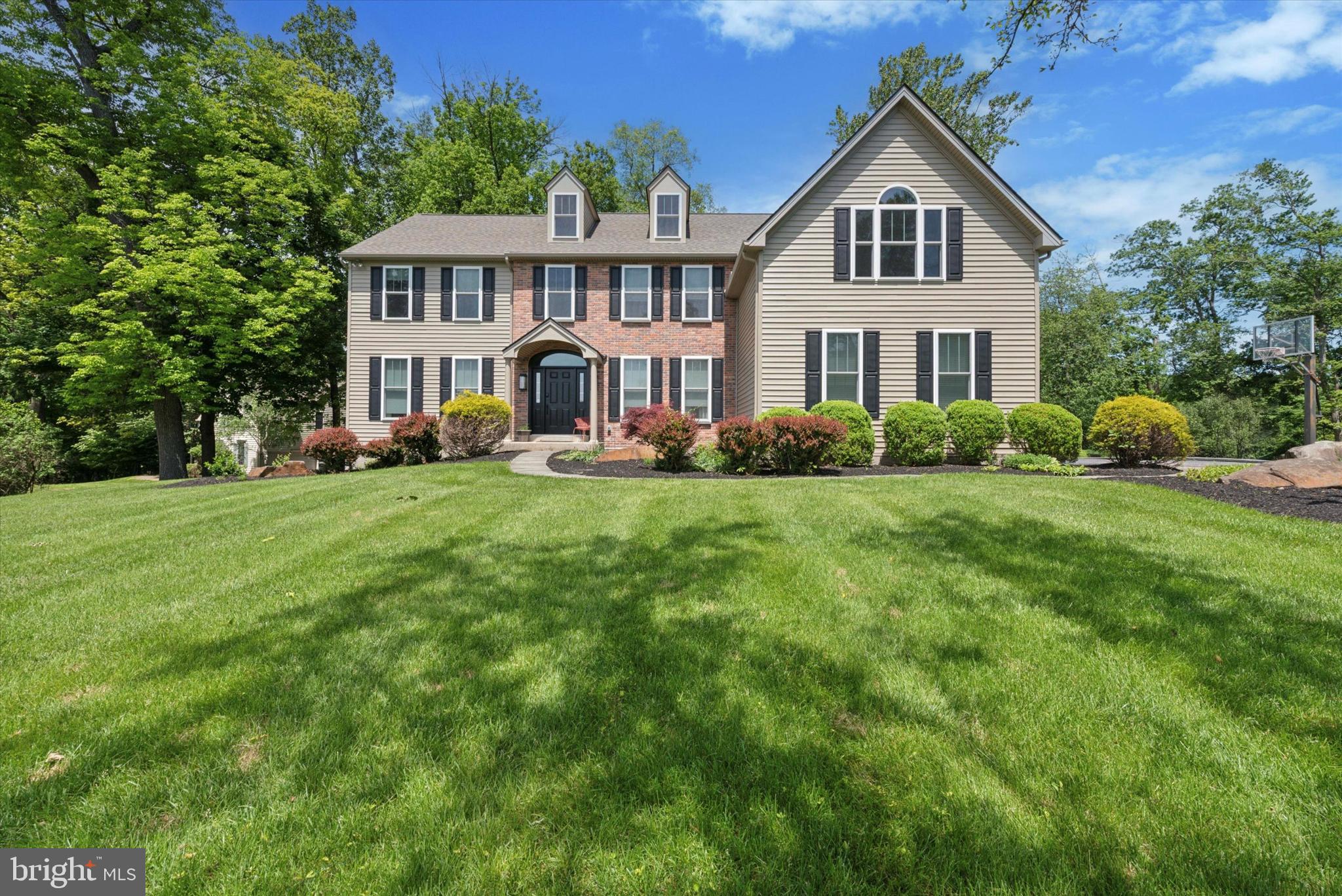 Welcome to 915 Kenmara Drive, a beautifully renovated Colonial residence nestled in the highly sought-after Kenmara community of West Chester, Pennsylvania. This elegant home offers over 5,100 square feet of upgraded living space on a meticulously landscaped large back yard opening up to a "Wyeth like” view of a picturesque farmette. Originally built in 1999, the interior was completely renovated in 2018 including kitchen, primary bath, hardwood flooring throughout, stairs, rails, fixtures appliances and more. In 2020, a new HVAC system was installed to ensure efficient climate control, and in 2025, the entire exterior received a stunning transformation, including new windows that enhance both aesthetics and energy efficiency.

As you enter through the grand two-story foyer, you are welcomed by an open, light-filled interior that flows seamlessly throughout the main level. The formal living and dining rooms showcase classic crown molding and gleaming hardwood floors, while the spacious family room centers around a cozy wood-burning fireplace, creating an inviting gathering space. The gourmet kitchen, thoughtfully updated during the renovation, boasts white cabinetry, a center island, a built-in hutch, and a five-burner stainless gas stove with a convection oven. Adjacent to the kitchen is a generous breakfast area, a mudroom, and a walk-in pantry, offering convenience and ample storage.

A private office on the main level provides a quiet retreat with views of the serene backyard, perfect for work or study. Upstairs, the primary suite features a vaulted sitting area, two large walk-in closets, and a spa-like en-suite newly renovated bathroom with dual vanities, a soaking tub, and a separate shower with seamless glass. Three additional bedrooms share a well-appointed hall bath, all with generous closets and abundant natural light.

Step outside to enjoy the professionally landscaped backyard, complete with a spacious deck—ideal for entertaining, outdoor dining, or relaxing in a peaceful setting. Additional amenities include a three-car garage, a main-level laundry room, and a full finished basement with a bedroom and bathroom for guests.

Located in East Bradford Township, this home offers a tranquil suburban lifestyle just minutes from downtown West Chester, local parks, top-rated schools, and major commuter routes. 

915 Kenmara Drive represents a rare opportunity to own a meticulously upgraded home in one of Chester County’s most desirable neighborhoods.