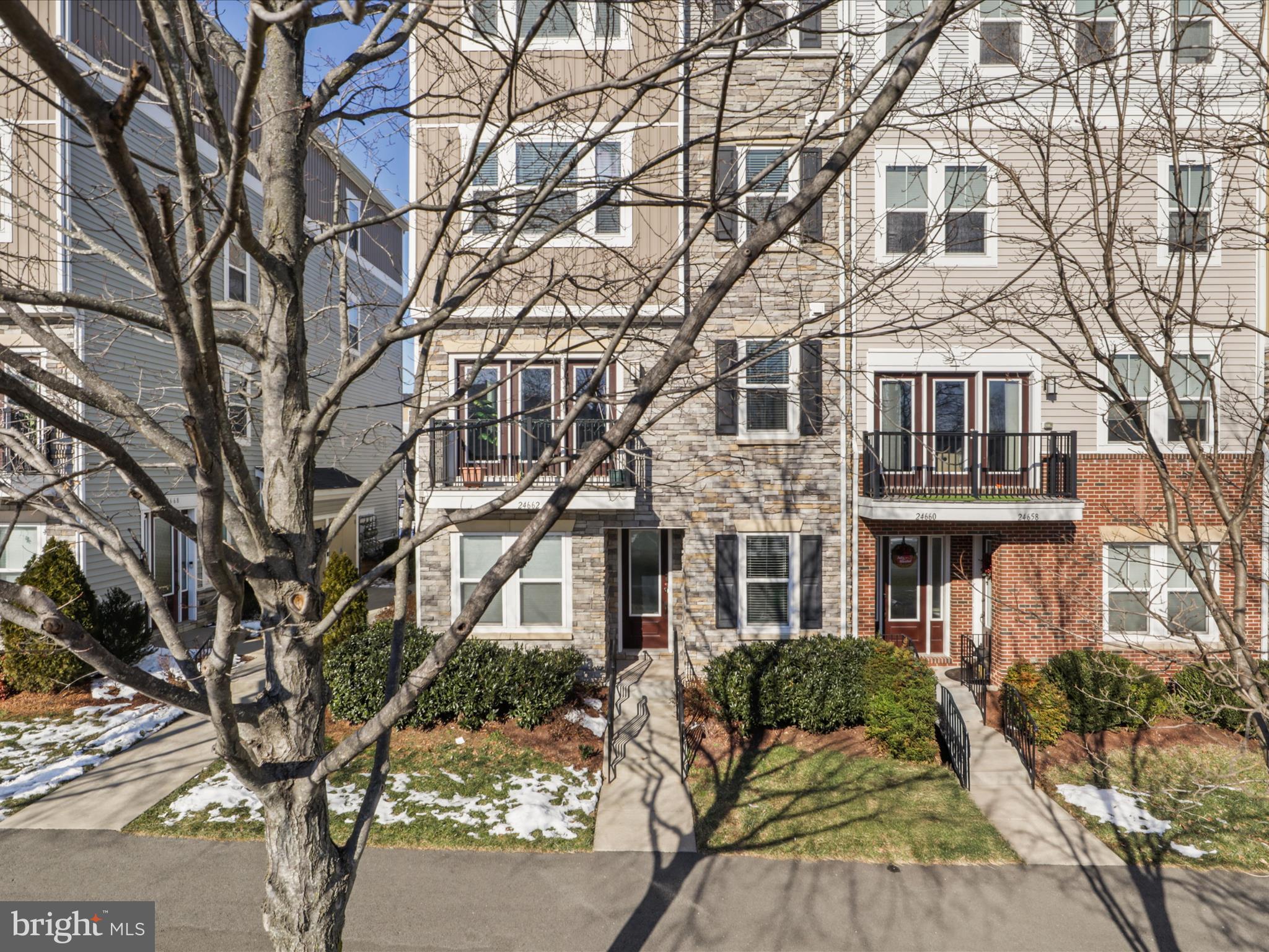 **PRICE REDUCED**Sought after Stone Mill Corner Condo with stunning upgrades throughout and like new! This 4 level condo has a spacious main level den space with mud room connection to the 1 car garage and 1 car driveway. Upper level #1 is an open concept living space with a gourmet kitchen consisting of highly upgraded cabinets, tiled backsplash and stone counters with SS appliances, living room, dining room, and half bath. Upper level #2 has the laundry room, the Owner's bedroom with a walk in closet (with a custom closet) and attached spa like bathroom consisting of dual sinks, large shower and soaking tub. Upper level #3 has 2 very large guest bedrooms and a shared hall bath with upgraded flooring and counters. The home has high end flooring and lighting throughout (carpet only on stairs and one upper level #3 bedroom)! Amazing location close to shopping, restaurants, the library, and so much more! Welcome home! **Water and Sewer utilities included in the Condo Fee**