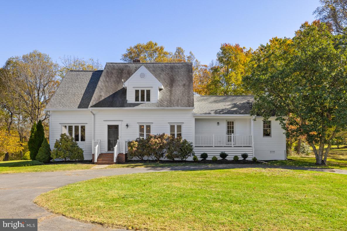 As one enters this wonderful 37-acre estate, one passes the large board fenced paddock on the left and through a mature allee of maples and pines before arriving at the beautifully renovated home. Centrally located on its 37 acres, the charming home is set well off the quiet lane of Beaverdam Bridge Road, affording maximum privacy.
The current owners, with backgrounds in building and design have made stunning additions and changes to the original 1979 home. Desiring to maintain the cottage feel, the expansive three-story addition is on the back of the home. Once inside, the home dramatically and seamlessly opens to the new areas, with large windows bringing in wonderful light. The wing to the right features a quiet space for a home office, a ½ bath, a sitting room, and a front porch.
The main body of the home offers spacious rooms which gracefully open into one another, providing space for large gatherings. The finish work is exceptional, including the flooring, trim, built-in cabinetry and the stunning kitchen. This is a chef’s dream kitchen, with beautiful cabinetry, quartz countertops, a large island with seating for 5, a 6-burner gas range, and 3 ovens plus a microwave.
The upper level features the elegant primary bedroom suite, sited perfectly for maximum privacy. This bedroom features a tray ceiling with chandelier, 2 walk-in closets and a spacious bath with soaking tub and walk-in shower. This level also features a second ensuite bedroom and 2 additional bedrooms which share a hall bath.
The lower level is unfinished, offers good ceiling height, and provides French doors to walk-out to the back yard. It houses the mechanical systems of the home and provides wonderful space for storage and potential for finished rooms.
This is a beautiful property with mature groves of trees and plantings, open fields and woodland with trails for walking and riding. In addition to the home, there is a garage, 4 stall barn, run-in shed, and garden shed; these additional structures are being offered in “as is” condition.
Beaverdam Bridge is a private location with convenience to Middleburg, Purcellville and Leesburg.  The proximity between Rt. 50 and Rt. 7 makes this an ideal location for those wanting to access Dulles International Airport and Washington, D.C. This property is in Land Use and Sellers will not be responsible for Roll-back taxes.