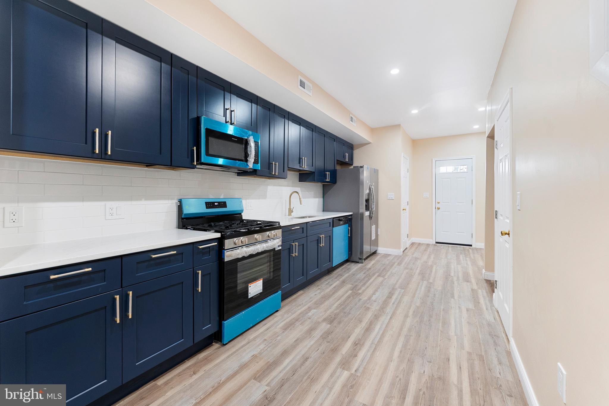 Back on the Market due to buyer non-performance. This beautiful Home has now passed various inspections with no major concerns and is ready for closing!

Completely renovated and move-in ready! This beautifully remodeled home offers the perfect blend of modern finishes and functional living space. The main level features a bright open-concept including a generously sized living room, an eat-in kitchen, and a half bathroom with stylish updates throughout. 

Upstairs you'll find two spacious bedrooms and a beautifully updated bathroom, while an additional room provides the perfect space for a home office or flex space to fit your needs, for a total of THREE rooms on the top floor.

The fully finished basement expands the living space even further and includes a private bedroom with a generously sized walk-in closet, a full bathroom, and a convenient Kitchenette-ideal for guests, extended family, extra income, or additional entertaining space. 

Every detail has been thoughtfully updated, offering peace of mind and a fresh modern feel through the entire home. With multiple living areas, flexible room options, a finished lower level, brand new plumbing, new electrical, new mechanicals, and private parking, this home truly stands out.

Don't miss the opportunity to own this turnkey property that offers comfort, style, and versatility all in one!

*Some images in this listing have been virtually staged to better showcase the true potential of rooms and spaces in this home and do not convey with the sale*