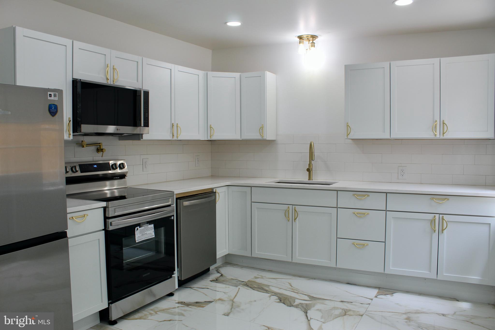 Stop Scrolling—This Is the One! Move right into this beautifully updated home featuring 3 bedrooms and 2.5 bathrooms, including a spacious primary suite with a walk-in closet, leading into the luxurious bathroom featuring a double vanity and a soaking tub along with a walk in shower. The modern kitchen is a chef’s dream walk onto the marble flooring with updated appliances and a pot filler above the stove, while the central air keeps you comfortable year round. Have a  peace of mind knowing they installed brand new windows, brand new flooring, a new water heater, new hvac, plus a fenced-in backyard perfect for entertaining! Don't wait schedule your showing today!