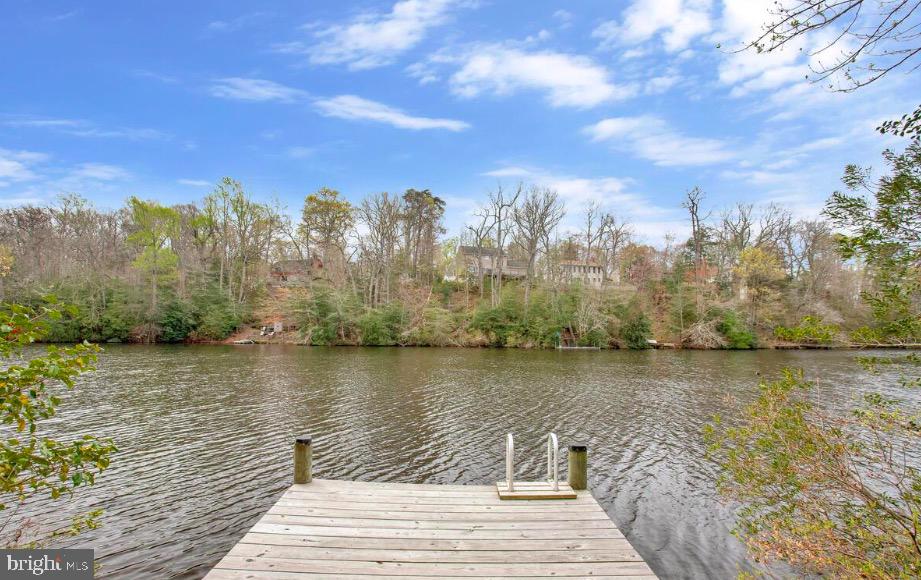 Lakefront Living on a Spacious 18,000 Sq Ft Lot with Private Dock Access
Welcome to this beautifully situated 3-bedroom, 3-bath lakefront rambler located in the amenity-rich community of Chesapeake Ranch Estates, offering low HOA fees and a true waterfront lifestyle.
Set on an expansive 18,000 sq ft lot, this home features direct lake access with its own private dock equipped with a ladder for easy entry—perfect for swimming, fishing, kayaking, paddle boarding, or simply relaxing on the water. Enjoy serene lake views from the oversized deck, ideal for entertaining or taking in the natural surroundings, including sightings of osprey, eagles, and other migratory birds. A large paved driveway provides ample parking, while the lower-level patio offers additional outdoor space for barbecues and peaceful afternoons. Community amenities include access to two private beaches, a lakefront beach, playgrounds, community gardens, an airstrip, and year-round activities for residents. Conveniently located near schools, shopping, and restaurants, and approximately one hour from Joint Base Andrews, 15 minutes to Solomons Island, and close to Naval Air Station Patuxent River. Enjoy four seasons of waterfront living in a peaceful, resort-style setting. House is Virtually Staged.