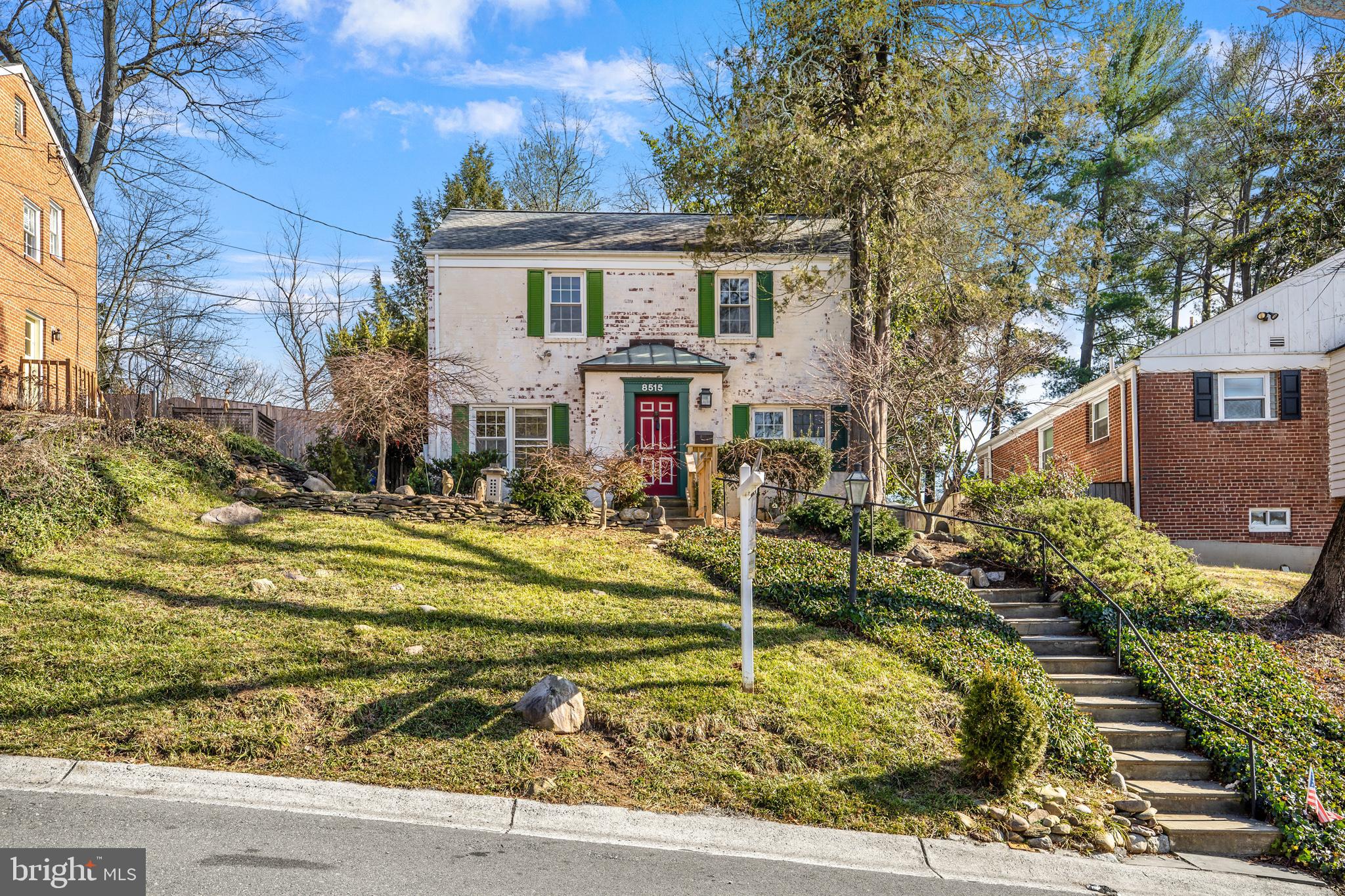 This charming brick colonial home, located in Rosemary Hills, boasts beautiful hardwood flooring throughout the main and upper levels. The spacious sunroom, complete with a skylight, provides the perfect setting for entertaining and overlooks a large backyard. Cozy up by the fireplace in the living room on chilly nights. Upstairs, you'll find three bedrooms and a full bath. The fully finished basement offers a versatile open area for entertaining and a fourth bedroom that could also function as a home office.