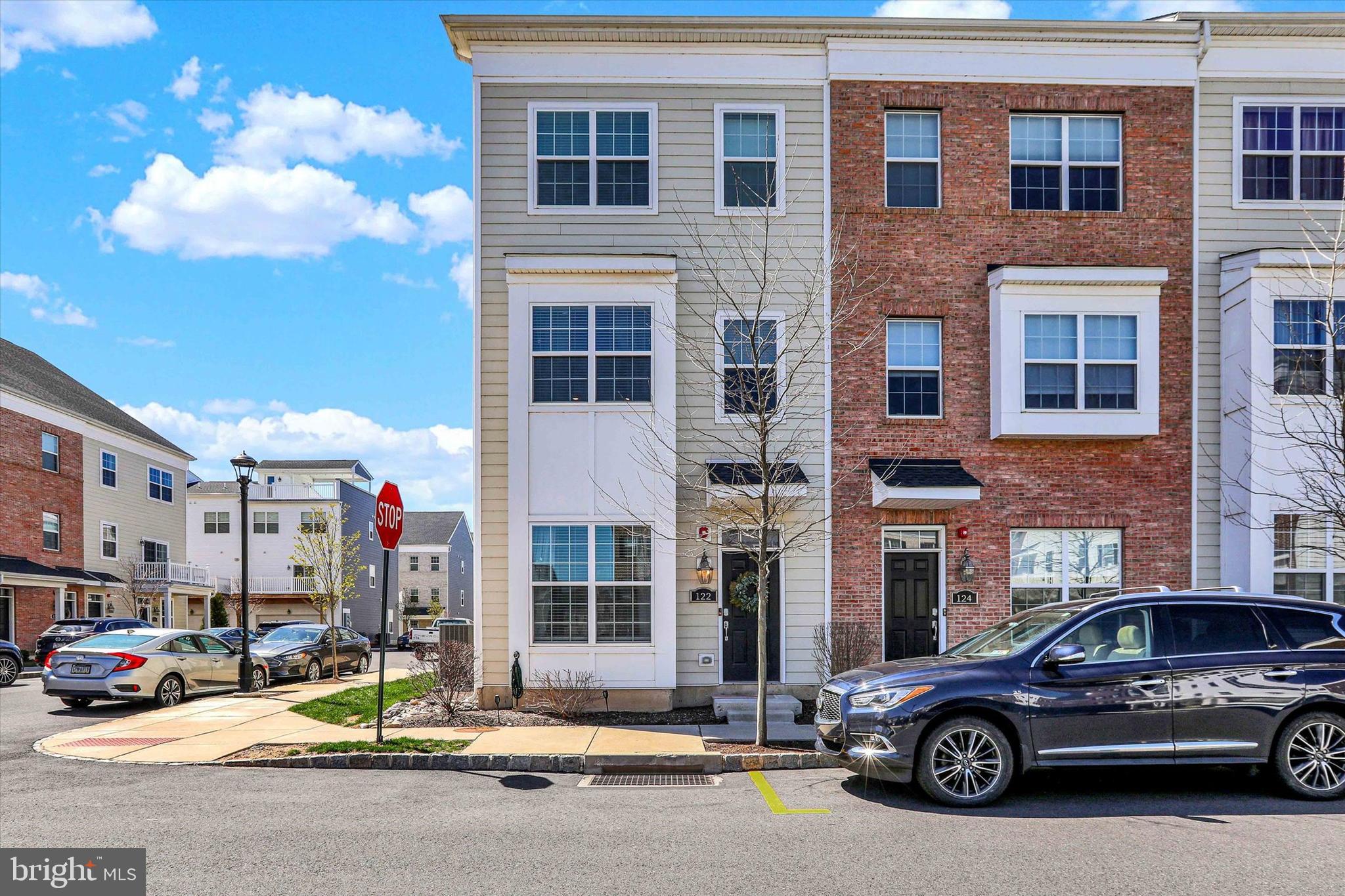 Welcome to 122 Easton St., a beautiful townhouse located in the Waterside community in Bensalem. This Alexandria model, end-unit townhouse was built in 2020 and offers multiple levels of living with a rear-entry, oversized 1 car garage that includes a new Level 2 Lectron EV charger (less than one year old - can be swapped out for NACS charger), and a lovely deck with river views off of the fourth level bedroom/loft. Upon entering this home, there is a den/office space on the first level, along with a sizable laundry room, featuring new, oversized washer and dryer (less than one year old) and a utility tub/sink. Entry to and from the garage is also on this level. Up the stairs to the second level is the expansive main living area that features a large, light kitchen with abundant counter and cabinet space, granite countertops and stainless steel appliances (less than five years old). There is also a large walk-in pantry in this kitchen area. Flowing from the kitchen is the sun-drenched dining area that connects to a spacious living room. Completing this level is a convenient powder room. On the third level, there is a primary bedroom with en-suite bathroom and walk-in closet, along with the second bedroom that also has a walk-in closet, as well as a hall bathroom. Up the stairs to the fourth level is a massive loft bedroom/recreation room, along with a full bath and walk-in closet. This space opens onto a deck that offers peaceful relaxation. This community offers walking paths along the river and is conveniently located to all means of transportation between Philadelphia and NYC. It is also convenient to abundant dining and shopping locations. Come see all that this lovely home has to offer!