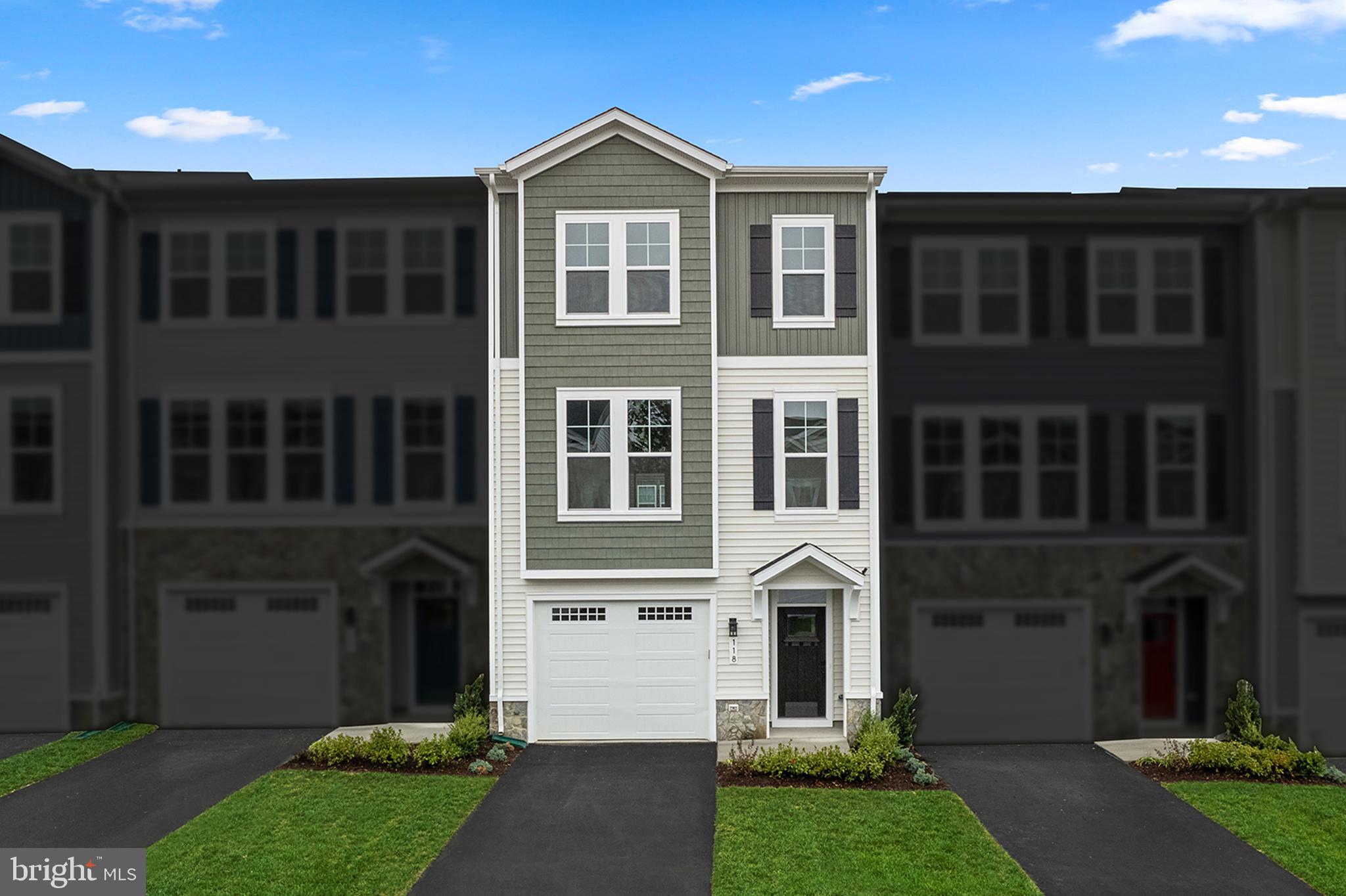 Welcome to this New Construction by Van Metre Homes ready for you to move in IMMEDIATELY! This Sugarloaf style townhouse was built to impress. When you enter the home you are greeted by a beautiful oak staircase stained to match the LVP flooring. With a finished basement, large garage, 3 bedrooms and 3/1 bathrooms spread over 3 levels, you are sure to have plenty of space. Once you enter the 2nd level you step into a bright and open floor plan with 9+ ft. ceilings. The kitchen highlights this area with stainless steel appliances, gas range/oven with exterior vented exhaust hood. The large island with quartz countertop separates the kitchen and open dining/living area. Making this area perfect for gathering or entertaining. Continuing to the 3rd floor you will find your primary bedroom with en-suite, 2 additional bedrooms and full hall bathroom. 
Experience a home that embraces your needs, making the Sugarloaf the ideal canvas for you to create cherished memories for years to come. LAKE FREDERICK, a gated community which offers outdoor living nestled in the Shenandoah Valley, between Winchester and Front Royal. The direct access to the great outdoors with relaxed living dedicated to friends and fun activities. Just outside your door, enjoy breathtaking mountain views and experience lifestyle amenities second to none. Grab a bite to eat at the award-winning Regions 117 farm-to-table restaurant. With access to Pickle ball, tennis courts, fire pits overlooking the lake, tot lots and miles of walking trails, then end the day watching the sun set over the foothills of the Blue Ridge Mountains and LAKE FREDERICK with your family and friends. *Take advantage of Closing Cost Assistance when working with Intercoastal Mortgage and Walker Title. **Pricing, incentives and homesite availability are all subject to change without notice. Images, renderings and site plan drawings are used for illustrative purposes only and should not be relied upon as representations of fact when making a purchase decision. For more information, see a Sales Manager for details.