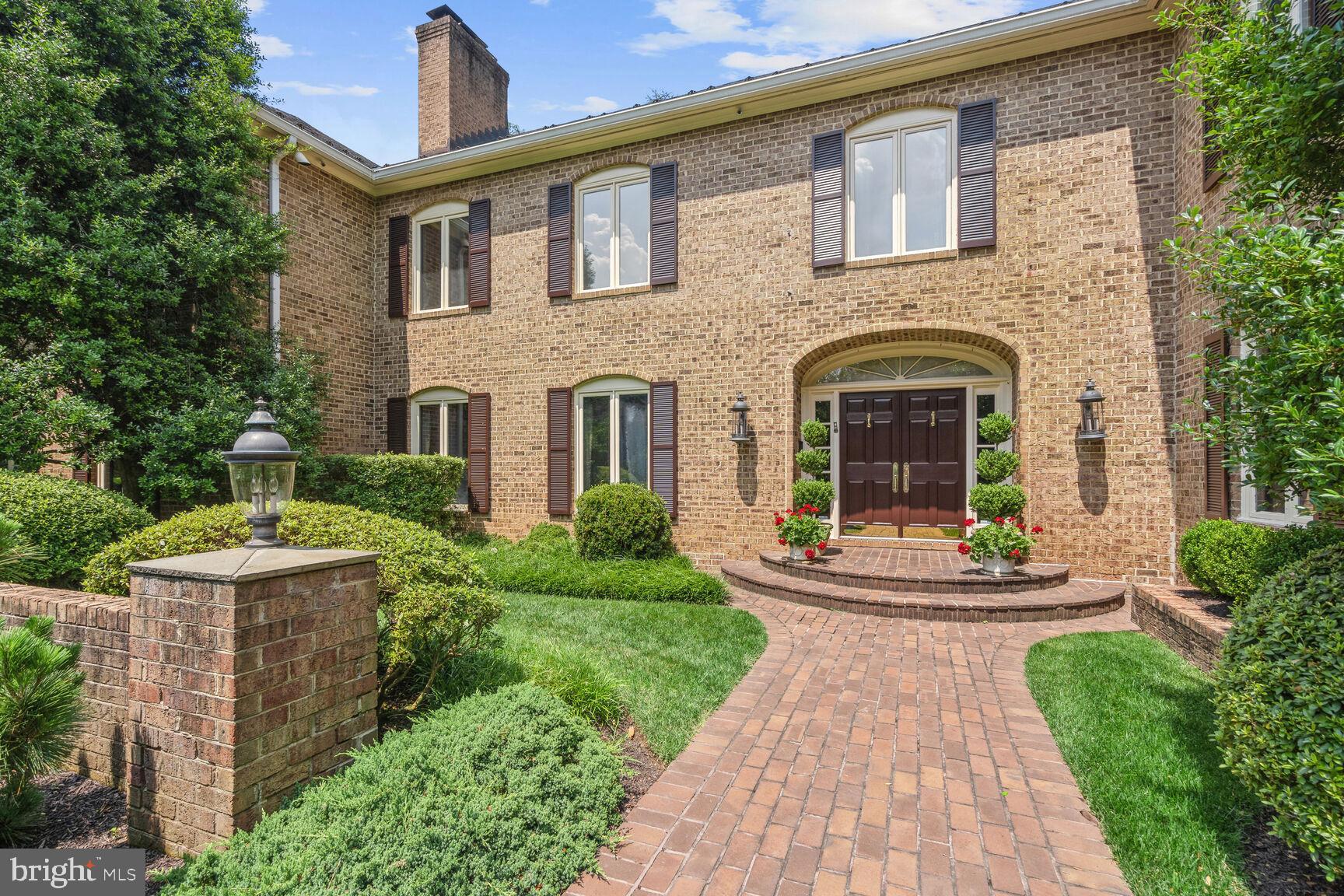 Situated on a gorgeous premium 2.28 acre lot in sought-after Potomac Falls, this magnificent custom-built brick colonial estate home, with 9'+ ceilings and over 10,000 sq ft of living space throughout three finished levels, includes a pool and pool house, tennis court, a circular drive, and 4-car garage parking, all impeccably maintained and loved by the current owners!  Enter into the gracious 2-story foyer with marble flooring; to the right is the 17'x 21' library with custom built-in shelves and cabinets, a formal powder room, wet bar, and an elegant 21'x 26' formal living room with fireplace. To the left of the foyer is a 17'x19' formal dining room with a gas fireplace, a 20'x 20.5' family room with a wood-burning fireplace, the serious cook's kitchen with an enormous island, premium cabinetry, top-of-the-line appliances, granite tops, and the adjacent breakfast room with tons of storage/pantry closets. The main level has a renovated laundry/mud room with garage access, a 2nd powder room, two staircases to the upper level, and a fabulous 13.5'x 32' sunroom with skylights and walls of windows for views of the lushly landscaped backyard and the pool house! The upper level encompasses an extraordinary 19'x 24' primary bedroom suite with a gas fireplace and two beautifully renovated and appointed primary baths, one on each side of the dressing room, and closets galore. The 6th bedroom  (which could be another family room or office) that is close to the primary bedroom suite, has a gas fireplace, an ensuite full bath, and a walk-in closet. Four other spacious bedrooms, with generously sized closets, and two additional full baths complete the upper level. The recently renovated lower level has a family room with built-in storage/shelving, a recreation/party/game room with a wet bar, a 7th bedroom with ensuite bath, a hobby/media room, an exercise room, another full bath, and two oversized storage/utility rooms. There are so many outstanding amenities throughout this stunning home! In addition to the exquisite flooring, moldings, and fine finishes, the home has a well-maintained slate roof, 5 HVAC systems (forced air heat and central air), a Kohler whole-house generator, and a  (2019) 75-gallon  water heater. The private backyard has a serene slate terrace, a tennis court, and a walkway to the oversized in-ground pool with diving board, gas pool heater, and automatic Polaris pool sweep, and the pool house with open entertaining space, a fully equipped kitchen, storage closet, changing room/full bath with shower, and a storage/utility room for pool equipment, etc....