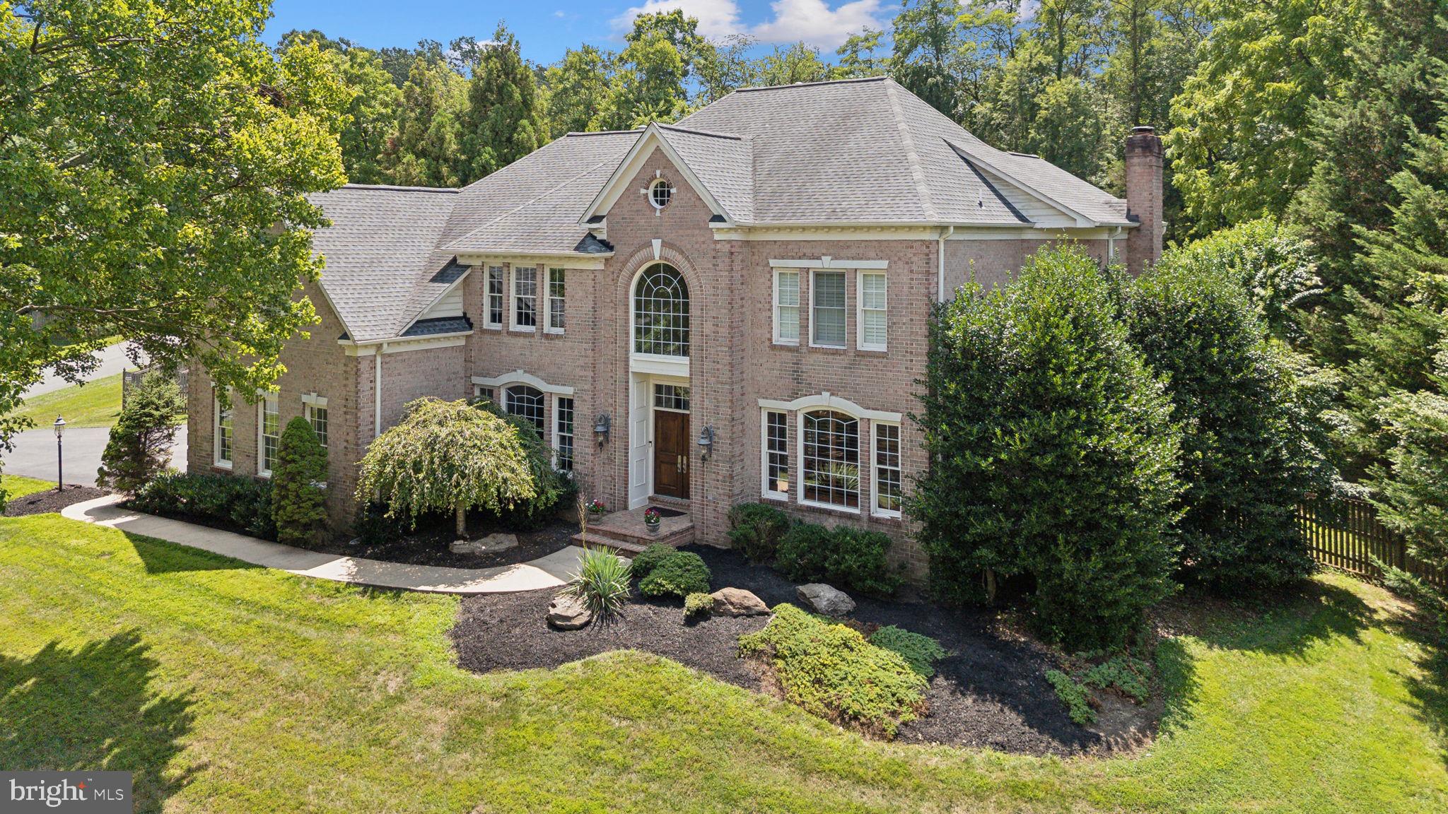 This stunning custom home, set on a sprawling one-acre lot, embodies resort-style living at its finest. The property is designed for both grand entertaining and everyday comfort, featuring expansive indoor and outdoor spaces.

Inside, the main level impresses with a gourmet kitchen, a spacious family room with a wall of windows, a formal dining room, a living room, and an office/study. A sunroom addition with a cozy gas fireplace provides a serene spot to relax and overlooks the private, fenced outdoor oasis.

The outdoor space is a true highlight, with a luxurious pool featuring a waterfall, a jacuzzi, and a slide, all surrounded by custom hardscaping and lush landscaping. This backyard paradise is perfect for casual dinners or formal gatherings.

On the second floor, you'll find five bedrooms and three full baths, along with a versatile space ideal for a homework zone, office, or playroom. The primary suite is a retreat of its own, boasting soaring ceilings, a two-sided gas fireplace, an expansive custom closet with an island, and a beautifully renovated bath.

The finished basement offers even more living space, including a large recreation area, a bar, a bedroom, a workout room, and ample storage. An oversized 3-car garage with a private entrance to the basement completes this exceptional home.

From every back window, enjoy breathtaking views of the backyard oasis, where the integration of indoor and outdoor living creates a tranquil, luxurious atmosphere throughout the home.