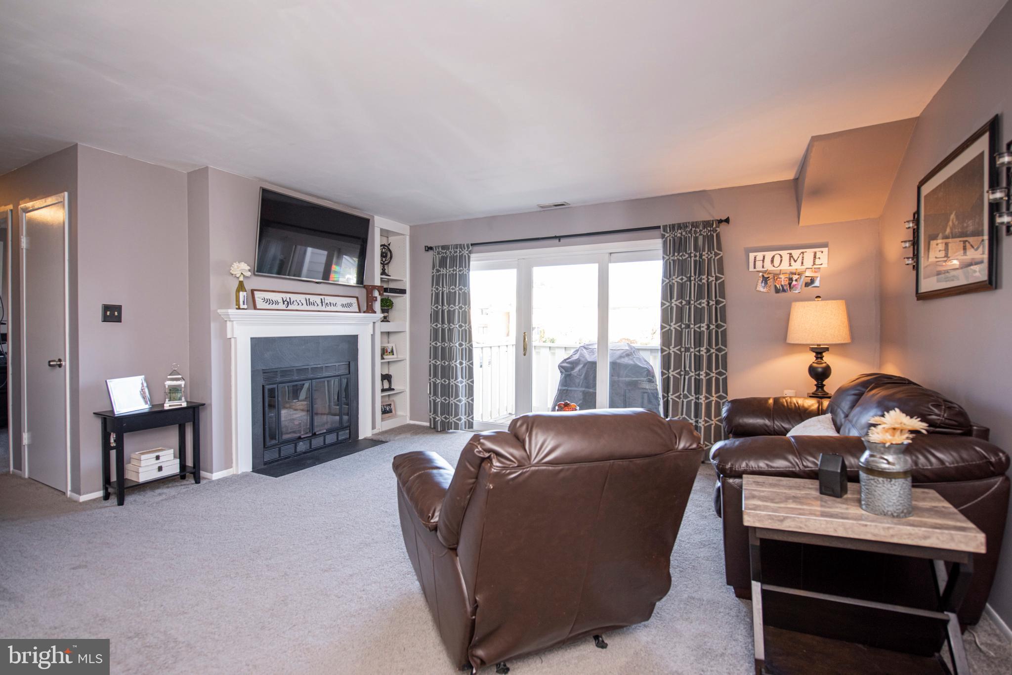 Charming updated 2 bedroom and 2 bathroom condo in the popular and desirable Wood Hollow community in Montgomery Township. Fabulously convenient to Wegmans, Home Depot , Montgomery Mall, restaurants and so much more.  More than one train station within a 10 minute drive. This unit is one of the few in the community with a fireplace and so nicely updated. Galley kitchen with granite countertops and tile backsplash adjacent to a nicely shelfed pantry and laundry room.  Both bathrooms are nicely updated and closet space in this condo is very generous. The sliding door leads to a patio and utility closet.  All condo residents get to enjoy the tennis courts, basketball courts, swimming pool and playground. Arrange for your visit today.
