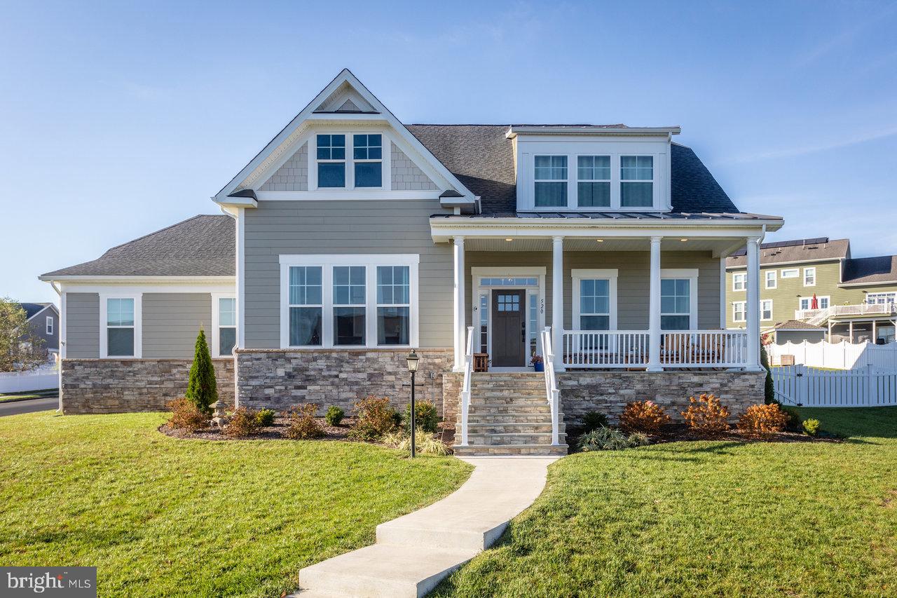This spacious and bright detached home in Preston Lake, built in 2022, offers exceptional living space with an intelligent floorplan and beautiful mountain views. The foyer is flanked by a formal living room and spacious dining room with paneled wainscoting, both soaked in natural light. The heart of the home can be found in the lovely family room, kitchen and breakfast room  space, featuring gorgeous engineered hickory floors. The family room offers custom built-ins, a gas fireplace, and French doors leading to the rear deck and patio. 
The kitchen is a chef’s dream, complete with a large quartz island, gas cooktop with pot filler,  abundant storage including a walk-in pantry, a farmhouse sink and high quality Fridigaire Professional stainless steel appliances.

The main level owner’s suite features a generously sized bedroom with tray ceiling, and large windows with spectacular natural light, a luxurious bath with a soaking tub, a tiled shower with glass enclosure and a rainfall showerhead, as well as two walk-in closets. The main level also includes a half bath and a very large mudroom/laundry room combination with a sink, upper and lower cabinets, and quartz countertop. 
Upstairs, there are two sizable bedrooms with ensuite full baths as well as a third bedroom with hallway access to one of the ensuite baths.   The home boasts nine-foot ceilings throughout. The very large unfinished lower level with rough-in for a full bath holds endless possibilities.

Outdoor spaces are equally impressive, featuring a covered front porch, a rear deck with composite decking for low maintenance, an additional paver patio, and a gracious fully fenced rear and side yards.  A two-car rear entry garage along with the driveway and ample street parking means your guests will be able to drop by anytime and the rear lane offers a private and safe area for biking or outdoor play!

Preston Lake offers a family-friendly lifestyle with open spaces, scenic trails, a playground, a clubhouse with a fitness center, a community swimming pool, and a dog park. Just minutes from downtown Harrisonburg, JMU, Rockingham Memorial Hospital, Massanutten Mountain, and is conveniently located near the county commuter road as well as Interstate 81. This impressive community provides peaceful living while being close to the conveniences of the city!