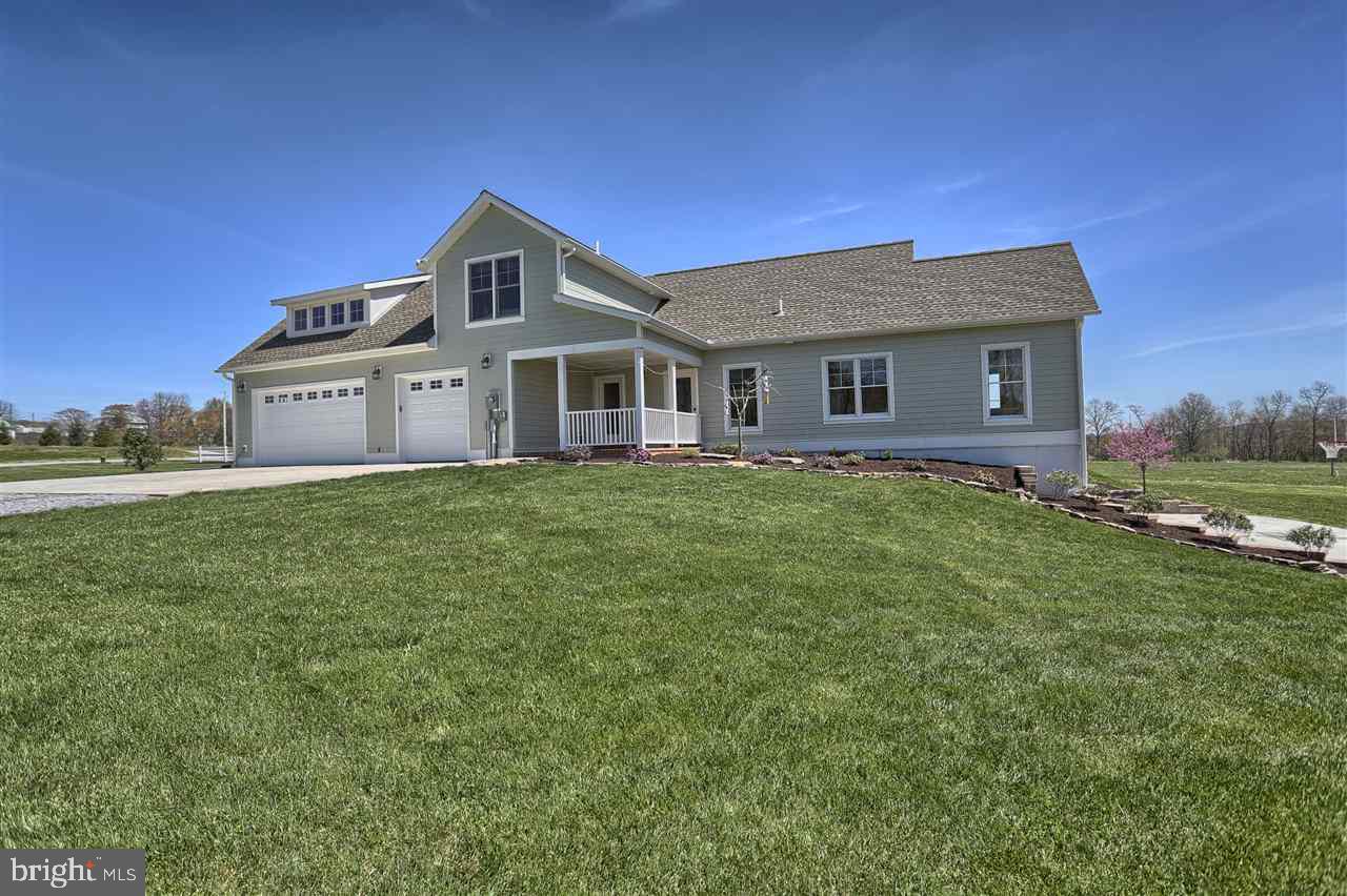 Meticulously crafted custom home on 14.05 acres features custom leather granite countertops, white oak flooring, a geothermal heating and cooling system, a wood/coal stove in the family room with 200 year old brick and large exposed beams throughout the home. Other features include an apartment above the garage with a full kitchen and bath, a large garage with heated shop inside, 2 laundry rooms, walk out basement, large slate patio w/fire pit and low voltage lighting, year round stream and camp site.