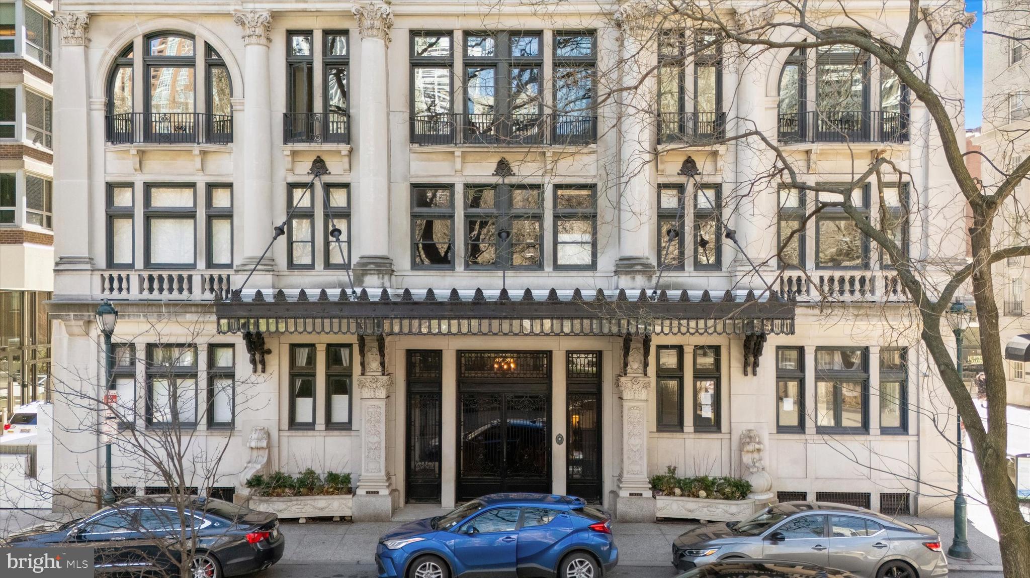Welcome to 1830 Rittenhouse Square, the first high-rise ever built overlooking Philadelphia’s most celebrated park and one of the city’s most architecturally significant addresses. Rich in history and timeless elegance, the building’s original 1920s sidelights still grace the stately main entrance, offering a glimpse into the refined character that defines this remarkable residence.Ascend via the building’s historic attended elevator to the 17th floor, where a private penthouse entrance leads up a private stairway to the 19th-floor home. Meticulously maintained and thoughtfully updated, this exceptional residence blends classic architectural detail with modern comfort. Soaring ceilings and expansive windows fill the home with extraordinary natural light and sweeping city views.A formal entry introduces the home and opens into a breathtaking living room with dramatic ceilings and a wall of windows capturing picturesque northern views across Rittenhouse Square and Center City. Original French doors lead to a gracious formal dining room designed for elegant entertaining. The dining space flows effortlessly into a newly renovated galley kitchen and continues outward to a spacious balcony,perfect for alfresco dining beneath decorative lighting while enjoying the city skyline.Just off the living room, a warm and inviting den provides a refined retreat. This comfortable space features generous seating, a decorative fireplace, and French doors opening to a second expansive balcony an ideal setting for evening gatherings under the open sky.The private bedroom wing offers tranquility above the city. The primary bedroom and second bedroom both feature soaring ceilings and original arched windows framing spectacular western views of the Philadelphia skyline. A beautifully updated bathroom connects the two rooms, blending modern finishes with timeless design. A third bedroom, located just off the entrance hall, provides another light-filled space complete with its own en-suite bath.Residents of 1830 Rittenhouse Square enjoy a collection of rare and distinguished amenities, including the only remaining attended elevator in Philadelphia, a fitness room, and an unmatched location in the heart of Rittenhouse Square. World-class dining, renowned museums, boutique shopping,major rail stations, and Philadelphia International Airport are all within effortless reach.This extraordinary penthouse offers a rare opportunity to own a piece of Philadelphia’s architectural history while enjoying elevated living above one of the city’s most iconic parks.