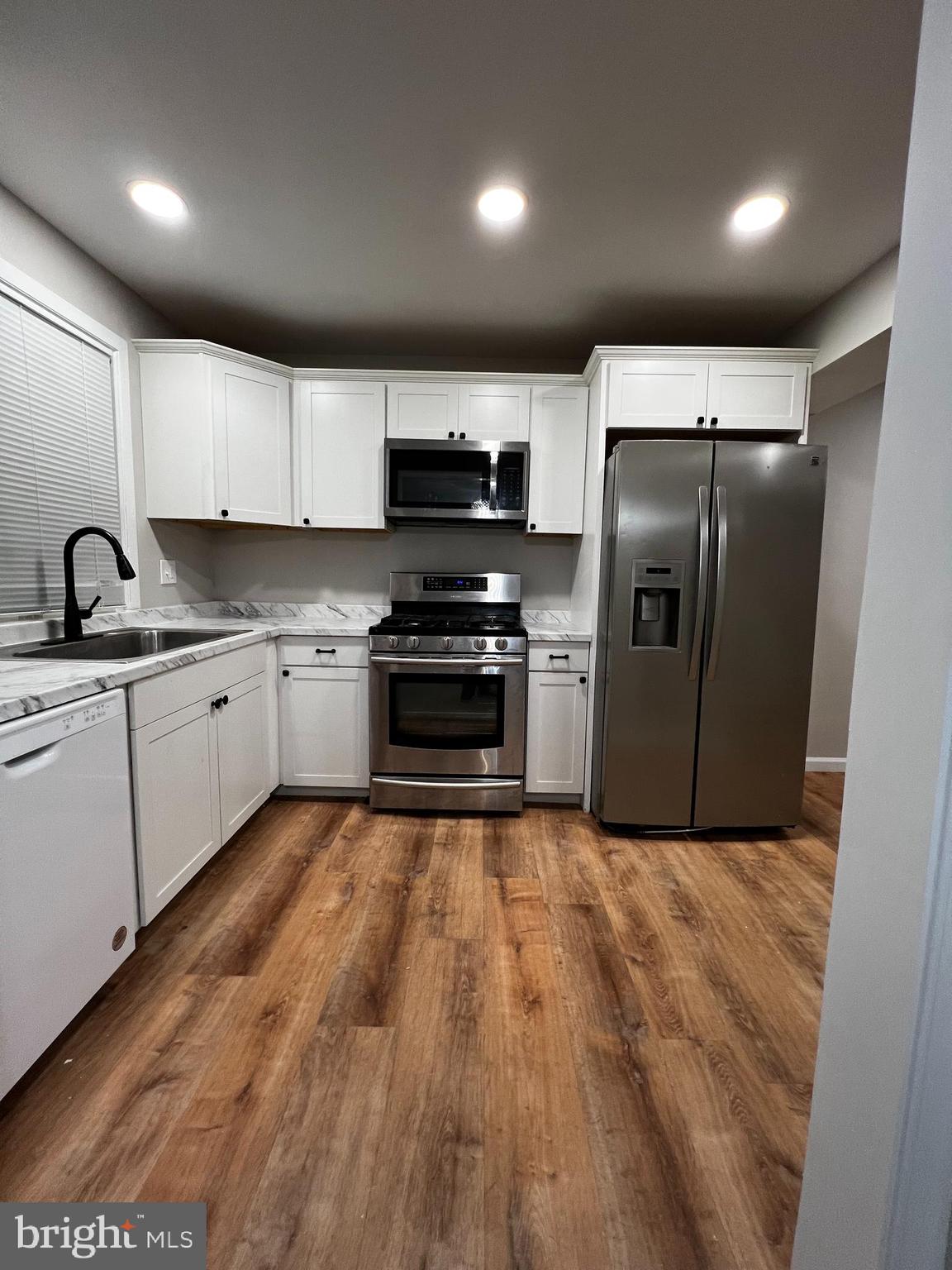 Renovated and ready to go.  Open kitchen floorplan with hardwood floors and seperate dining area.  2 bedrooms and 1 bath on the upper level.  Right behind Iverson mall.  Walking distance to public transportation.  Call helpful agent with questions..