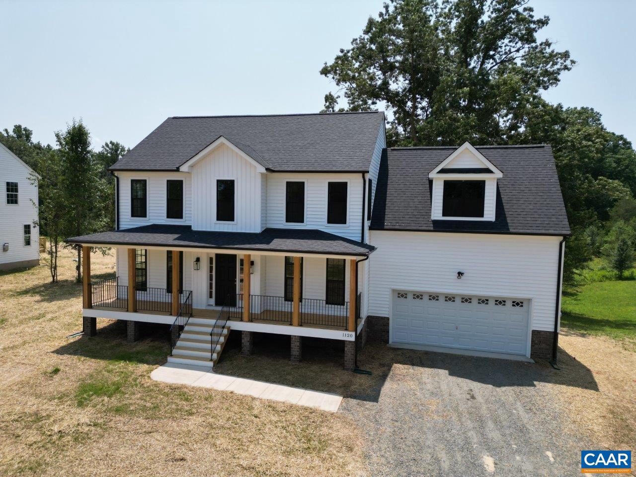 Footer installed! Stunning farmhouse w/ full length porch & 2 acres, wide open views & NO restrictions! 8" stained porch columns w/ iron rails, double entry true French doors, upgraded window & siding accents complete the look. Primary suite offers spacious privacy w/ ensuite bath, 5ft shower & Double Vanity. Main level engineered HW floors, Oak Stairs, plus extra 6' windows add to the open plan that takes in the scenery from every direction. Country kitchen with farmhouse sink, upgraded cabinets, granite, huge island, and rear deck overlook the sunny back yard & adjoining farm. Photos & Virtual Tour are a similar completed home that may include features not planned @ this location. Up to $7,500 in closing cost incentives available. Ask for details!