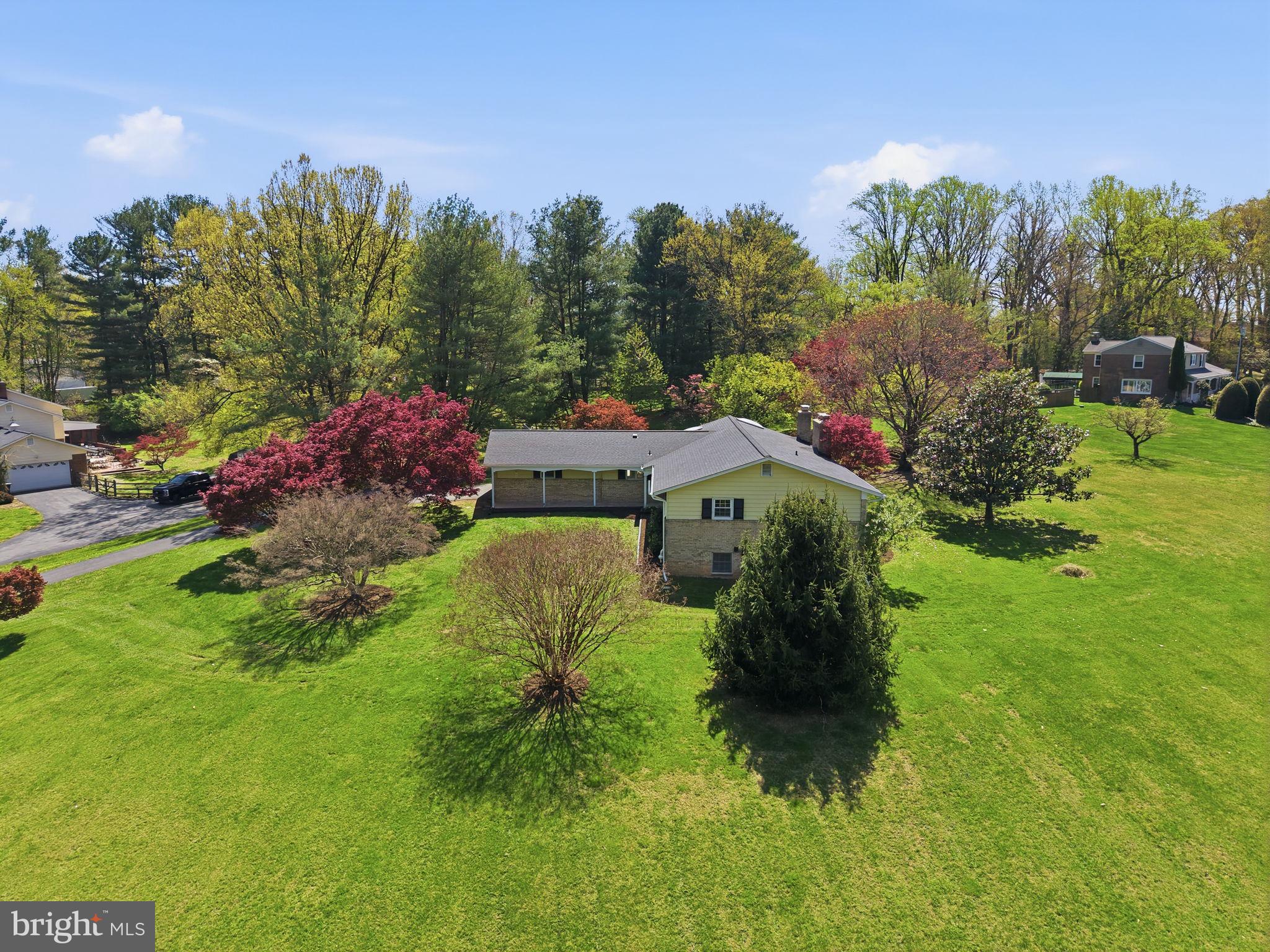 Set at the end of a quiet cul de sac, 2015 Sondra Court offers a rare combination of privacy, scale, and flexibility, with four bedrooms, three renovated full baths, a vaulted, skylit sunroom, and two expansive acres that create a true sense of retreat. While the address carries a Silver Spring designation, the experience is notably more aligned with Olney, just 10 minutes away, where everyday conveniences, dining, and shopping are easily within reach. Approaching the property, the landscape opens to glimpses of surrounding farmland, setting a tone that feels more pastoral and removed from the pace of nearby urban centers.

Positioned on two acres framed by mature trees and natural greenery, the home is thoughtfully sited to maximize both seclusion and usability. A freshly refinished deck overlooks the grounds, offering a natural extension of the living space and an ideal setting for outdoor entertaining or quiet daily living.

Inside, the main level unfolds with an easy, connected flow between the living room, dining area, and kitchen, creating a layout that supports both casual living and more formal gatherings. The kitchen, fully renovated in 2018 and enhanced with a sleek induction cooktop in 2026, balances function and clean lined design with updated cabinetry and appliances. Just beyond, a large sunroom serves as a defining space within the home, with vaulted ceilings and skylights that draw in natural light throughout the day and create a sense of volume and openness. It functions equally well as a secondary living area, workspace, or everyday gathering space, with views that connect seamlessly to the surrounding landscape. Natural light moves easily throughout, reinforcing a sense of openness across each of the primary living areas.

The main level is anchored by three bedrooms and two renovated full baths, including a primary suite with an ensuite bath. The additional bedrooms are well proportioned and supported by a second renovated full bath, offering flexibility for family, guests, or work from home needs, all within a convenient single level living arrangement.

The lower level introduces an entirely separate dimension of living, featuring an additional bedroom and renovated full bath, along with its own private exterior entrance. A spacious recreation room anchors the level, complemented by a dedicated laundry room and a massive storage or work room that offers flexibility for hobbies, a workshop, or future finished space. The overall configuration lends itself to a variety of uses, including guest accommodations, extended stays, or a more independent living arrangement.

A series of meaningful system updates contribute to long term comfort and efficiency, including a new electrical panel and washer and dryer in 2018, water heater and heat pump in November 2019, and a mini split system in the sunroom. The roof was replaced in 2021, the septic system was pumped in 2024, and HVAC systems were serviced in 2026, reflecting consistent and thoughtful maintenance.

From a connectivity standpoint, the home is ideally positioned for both daily commuting and regional access. The ICC, Route 200, is approximately five minutes away, providing a direct link across Montgomery County, while I 495 is accessible in roughly 15 minutes, allowing for convenience without compromising the quiet character of the setting.

At 2015 Sondra Court, the appeal lies in the balance, a property that offers land, flexibility, and a sense of calm that is increasingly difficult to replicate.

Floorplan relfects total square footage of 3,640.
Public record reflects total square footage of 3,585. 
All measurements are approximate. Property details and square footage should be independently verified, and not used for property valuation.