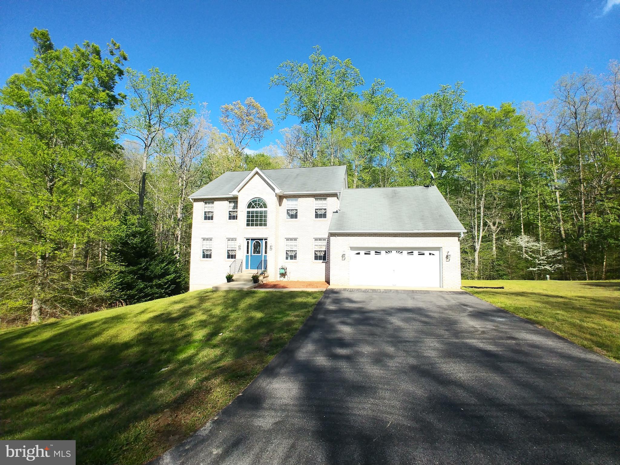 ***PRICE REDUCED***FANTASTIC HOME***FINISHED BASEMENT***CHECK IT OUT TODAY***Welcome home to this beautiful brick front colonial featuring a new front door, fresh paint, new carpet and a rear deck to relax. You are sure to be pleased with the finished walkout basement featuring a bar, family room, and huge office/workout room. With over 4000+ square feet of living area, all of the rooms are super spacious. The main level bedroom would be ideal for a family member who prefers not to do stairs (just a small closet needed) or could be utilized as an office. This property is centrally located  for either a DC or Pax River commute.  Other features include a master bath soaking tub, dual zoned HVAC, walk-in closet, electric fireplace, 2 sheds, all on almost a 1 acre lot. Don't wait, claim your new home!