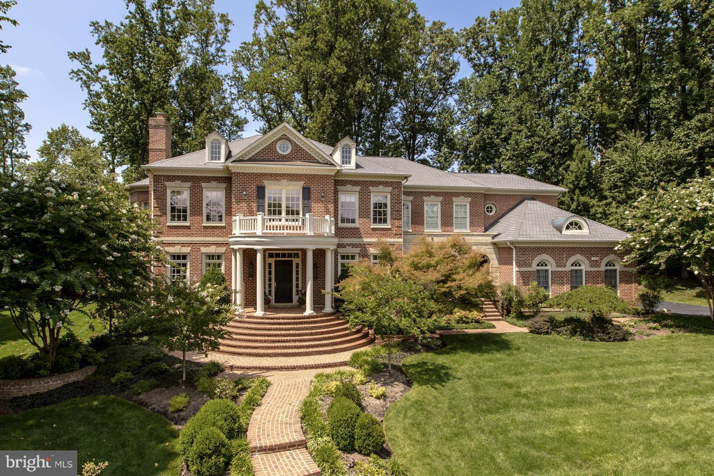 LOVELY  All brick home built by Basheer & Edgemore in The Reserve. Fabulous architectural details with arched doorways and spectacular paneled rotunda ceiling,  2 story  family room & a  first floor office with cherry built in's. 6 BR/6.5 BA. Main Level Bedroom & Full bath. Sunny & Bright with floor to ceiling windows. Hard to find, level, deep rear yard.3 Car Side Load Garage.