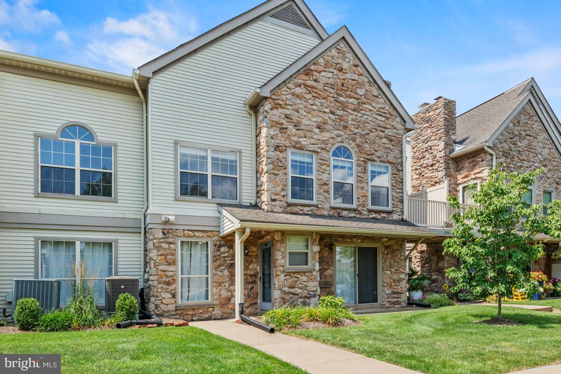 Welcome to this beautifully updated three-bedroom, two-full-bath condominium offering an exceptional combination of spacious living, soaring architectural design, and an unbeatable location in the heart of desirable New Britain Township. From the moment you arrive, you'll be impressed by the attractive stone-accented exterior, charming second-floor balcony, and the convenience of an expansive, well-lit parking area with abundant guest parking.

Step inside to discover a bright, open-concept floor plan enhanced by dramatic vaulted ceilings, oversized windows, and an abundance of natural light that fills the home throughout the day. Fresh neutral paint and luxury vinyl plank flooring extend throughout every room, creating a modern, cohesive aesthetic that is both stylish and low maintenance. The spacious living room is highlighted by impressive ceiling heights and a stunning stone-surround wood-burning fireplace that serves as the focal point of the space, creating the perfect setting for relaxing evenings or entertaining family and friends.

The open layout seamlessly connects the living room to the dining area and kitchen, providing an ideal flow for everyday living. The kitchen is equipped with stainless steel appliances, including an electric range, dishwasher, built-in microwave, garbage disposal, and ample cabinetry and counter space, making meal preparation both convenient and enjoyable.

The expansive primary suite is truly a private retreat, featuring soaring ceilings, abundant natural light, a massive walk-in closet, an additional supplemental closet for even more storage, and a luxurious en-suite bathroom designed for comfort and convenience. The spa-inspired primary bath offers a relaxing soaking tub, a separate walk-in shower, and dual vanities, providing ample space for busy mornings while creating a peaceful atmosphere to unwind at the end of the day.

Two additional generously sized bedrooms provide flexibility for family members, guests, or a dedicated home office. A second full bathroom is thoughtfully located nearby to comfortably accommodate both residents and visitors. The conveniently located main-level laundry room adds to the home's practical design, while ceiling fans throughout enhance year-round comfort.

Location is everything, and this home truly delivers. Enjoy the convenience of being less than a two-minute walk to the New Britain Shopping Center, where you'll find Wawa, popular restaurants, pizza, shopping, and everyday conveniences just steps from your front door. The surrounding community also offers scenic walking trails that weave throughout the adjoining neighborhood, making it easy to enjoy morning walks, evening strolls, or outdoor exercise.

Commuters will appreciate the close proximity to SEPTA train service, bus routes, and major roadways, providing convenient access throughout Bucks County and beyond. Historic Doylestown Borough, with its renowned restaurants, boutique shopping, museums, entertainment, and year-round community events, is only minutes away.

Outdoor enthusiasts will love being just minutes from Peace Valley Park, one of Bucks County's premier recreational destinations. This spectacular park features a beautiful lake, a scenic 6.2-mile paved trail surrounding the water, nature preserves, fishing, boat launches, kayak and canoe rentals, picnic areas, and endless opportunities to enjoy the outdoors.

Located within the highly acclaimed, award-winning Central Bucks School District, this exceptional home offers an outstanding opportunity to enjoy comfort, convenience, and an incredible lifestyle in one of Bucks County's most sought-after locations.

Finally an affordable home in Bucks county with very low taxes!

Don't miss your opportunity to make this beautiful home your own. Schedule your private showing today before this exceptional property is gone.

*This property has been virtually staged for inspirational purposes.*