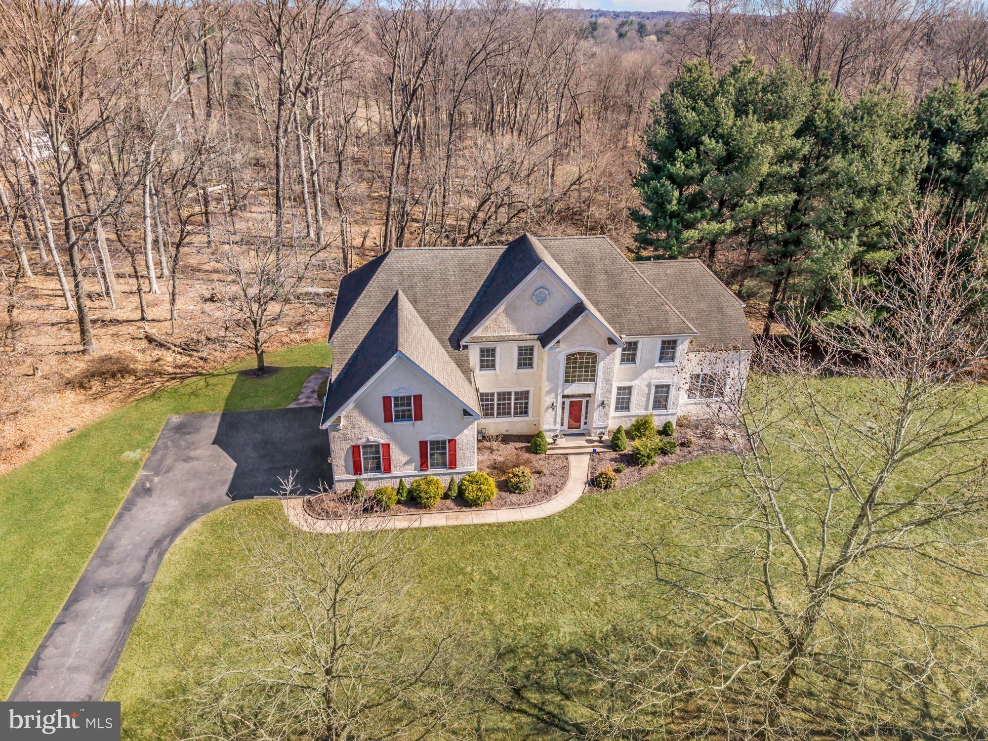Available now in the highly desirable Steeplechase at Radley Run development, in the award-winning West Chester Area School District! Steeplechase is an enclave of 29 executive-style estate homes with 40 acres of deed-restricted open space, and three private walking trails. This impressive 5-bedroom, 4.5-bath home is ideally situated on a large corner lot at the end of a cul-de-sac, offering both privacy and beautiful wooded views.
Step into the light-filled two-story foyer with hardwood floors that opens to the formal dining room, living room, and a stunning conservatory/sunroom. The main level also features a private office overlooking the wooded rear yard, a dramatic two-story family room, and an open-concept gourmet kitchen with granite counters & island, 42” cherry cabinets, and spacious breakfast area—perfect for both everyday living and entertaining. The kitchen features sliders to a maintenance free trex deck. A laundry room, powder room, and mudroom finish off the first floor along with convenient access to the attached three-car garage.
Upstairs, an open balcony overlooks the foyer and family room and leads to 5 generously sized bedrooms. The primary suite offers a peaceful retreat with a sitting room, walk-in closet with custom organization system, and a recently renovated spa-like en-suite bath. 3 additional bedrooms, hall bath, and guest bedroom with en-suite complete the 2nd level.
The daylight walkout lower level provides exceptional flexibility with a bar area, full bathroom, and ample storage—ideal for entertaining, recreation, or potential multi-generational living such as an in-law or au pair suite. The basement features a custom bar with wet bar/sink and copper top. The double French door walkout leads to the beautiful rear yard featuring a custom-made fire pit on the expansive paver patio and serene wooded views, creating a private outdoor setting perfect for relaxing or hosting guests.
The home features generous living spaces designed for comfortable everyday living and effortless entertaining. The peaceful setting combines the best of neighborhood living with scenic surroundings, all just minutes from downtown West Chester, major commuter routes, shopping, and dining. Longwood Gardens is 15 minutes away along with all the serene, beautiful country-like living and horse farms of Chester County.
A rare opportunity to own a beautifully appointed home in one of the area’s most sought-after school districts.