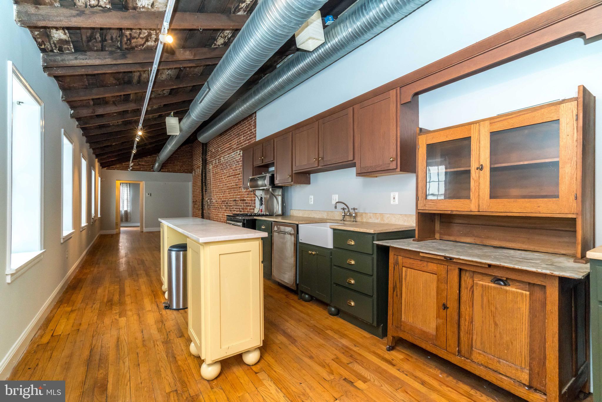 Huge  Fells Point 2nd level hidden gem - 2 beds 2 full bathrooms. This is an expansive 2nd-story apartment, complete with massive gourmet kitchen, hardwood floors, exposed brick, exposed beams, natural light, huge laundry room, large bedrooms/ bathrooms and TONS of character, charm and living space.  Also enjoy a private outdoor deck area, secure entrance, tons of privacy and this AMAZING LOCATION. Call to schedule your private tour today. NON REFUNDABLE $40 app fee PER PERSON and ONE TIME $60 processing fee due at lease signing.