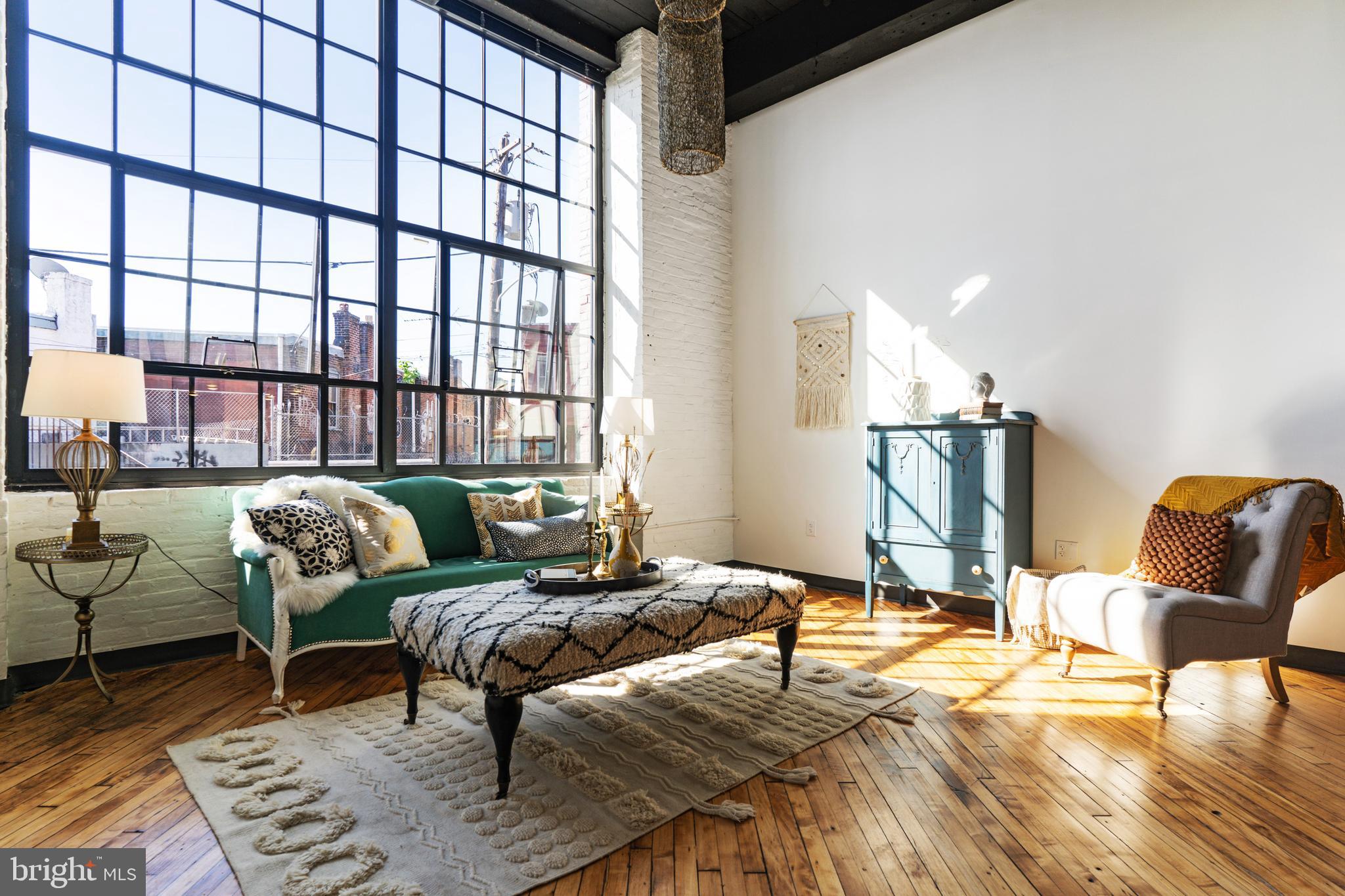 Check out this beautiful industrial style studio apartment with stairs to a lofted bedroom.  Advertised Rent is for a 15mo lease.  The sky high ceiling and enormous wall of windows fill with light and class.  Our favorite things are the updated cook's kitchen with stainless steel appliances and handy counter and cabinet space.  You'll love how the kitchen counter nook opens into the living area, perfect for a couple stools.  Design wizards will love the original hardwood floors and open ceilings.  A shared laundry room is right down the hall.  J-Centrel is a renovated textile factory located in a re-energized section of Kensington and Harrowgate along the Market-Frankford El corridor one block from the Tioga El Station.  Amenities include tenant lounges, fitness center, mail room, bike room and keyless entry. Responsive landlord and maintenance team.  Tenants pay electricity, cable, and renter's insurance (apartment is all electric).  $50 Application/credit check.  Security deposit, 1st and last month's rent moves you in.  We can't wait to show you this apartment.