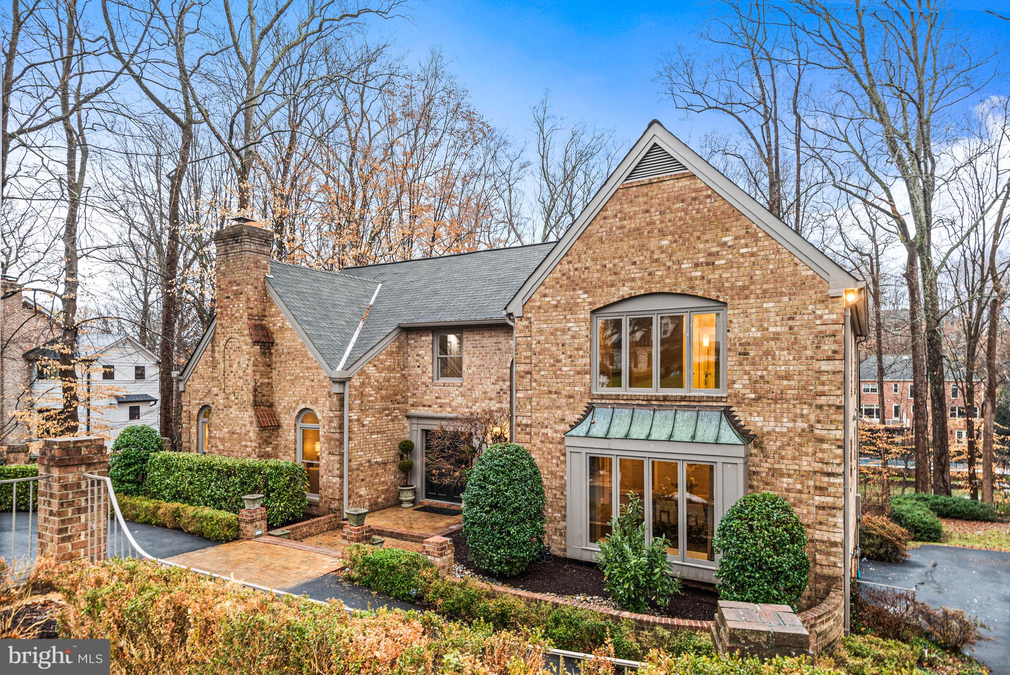 Nestled on a tree-lined .66-acre cul-de-sac lot in the established and private River Oaks neighborhood adjacent to Scott’s Run Nature Preserve, this beautiful 6 Bedroom, 6 Full and 1 Half Bathroom all brick home with effortless main level living boasts over 6000sf of finished living space on 3 spacious levels.  Located in the top-rated Langley High School pyramid, the home was recently refreshed, making it an ideal retreat for everyday living, lively entertaining, and intimate gatherings.
The heart of the home is the expansive Kitchen equipped with granite countertops, a large island, and stainless steel appliances, including  side-by-side refrigerator, double GE wall ovens, and two Bosch dishwashers. The space opens to the breathtaking Breakfast Room which is bathed in natural light from greenhouse-like windows and skylights with serene views of the private wooded backyard. 
The rest of the main level balances functionality and beauty. The formal Living Room, located in the front of the home, with its beautiful hardwood floors, delicate decorative moldings, large arched windows, and wood burning Fireplace, is ready to welcome guests or provide space for a private retreat from the rest of the house.  The large Dining Room, with floor to ceiling windows, is conveniently connected to the Kitchen by a Butler’s Pantry, ensuring seamless and gracious hosting.  While the Family Room, with its vaulted ceilings, wood-burning Fireplace, and two sets of French doors to the upper terrace overlooking the property, is a place where memories are made. 
Retreat to the  luxurious main-level Primary Suite where vaulted ceilings, hardwood floors, two more sets of French Doors and dual walk-in closets offer a quiet respite. Step out to the upper terrace to take in the air with your morning coffee or unwind in the recently refreshed Bathroom, featuring new dual vanities, a soaking tub, separate shower, two water closets, and a third walk-in closet.
Upstairs, an open landing anchors three oversized Bedrooms, each with its own updated ensuite bathroom, creating private spaces for family or guests. The walkout lower level is equally impressive, featuring a spacious Recreation Room with another wood-burning Fireplace and double French Doors to the lower level deck and yard, two additional Bedrooms with ensuite Baths, a massive storage room, and direct access to the two-car Garage.
Outside, the story continues with tranquil surroundings and thoughtful updates. The main-level deck, replaced in 2019 and recently resealed, provides the perfect setting for al fresco dining or quiet reflection. Situated near Scott's Run Nature Preserve and Langley Swim and Tennis Club, this home offers easy access to outdoor adventures and community amenities. With close proximity to I-495, the GW Parkway, Dulles Toll Road, Tysons, and downtown McLean, convenience is at your doorstep.