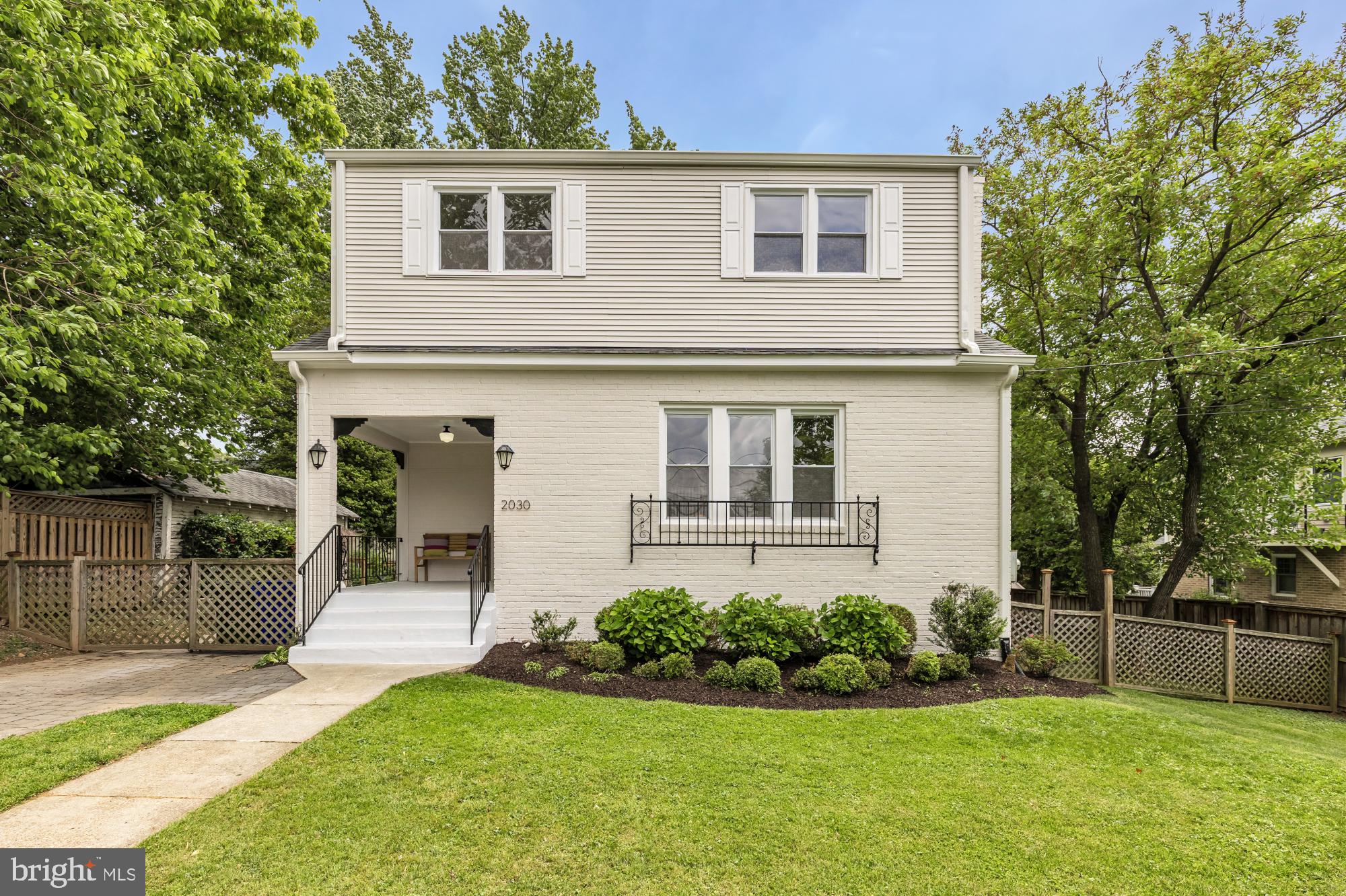 Tucked into the sought-after North Woodside neighborhood, 2030 Luzerne Avenue offers the perfect blend of charm, community, and convenience just moments from Downtown Silver Spring and easy access into Washington, DC. Known for its tree-lined streets, welcoming atmosphere, and walkable feel, North Woodside is one of Silver Spring’s most beloved neighborhoods. Positioned directly across from Woodlin Elementary School, the home offers an exceptionally convenient daily rhythm with parks, schools, neighborhood gatherings, and everyday amenities all woven seamlessly into the surrounding community.  Enjoy close proximity to Downtown Silver Spring dining, shopping, parks, entertainment, Metro access, and popular local destinations including Zinnia, All Set Restaurant & Bar, Quarry House Tavern, Sligo Creek Park, and Woodside Urban Park.

Set back from the street on a generous lot, this home offers both privacy and inviting outdoor living. A charming front porch provides the perfect place to enjoy morning coffee or unwind in the evening. The fully flat, fenced-in backyard features a brick patio, gardening beds, a storage shed, and expansive green space to run, play, entertain, or relax, along with thoughtfully designed hardscaping that enhances both function and curb appeal.

From the moment you walk in, the home feels bright, warm, and easy to settle into. Large windows fill the living room with natural light, while the fireplace gives the space a cozy focal point. It’s easy to imagine summer days with the front door open, everyone moving in and out, kicking a ball in the yard, enjoying the freedom and space to play and gather. In the colder months, the living room becomes the heart of the home, a place to cozy up by the fire for favorite board games, movie nights, and quiet evenings together. The kitchen is one of those spaces that naturally becomes the center of daily life, designed as much for gathering as it is for cooking. With generous storage, expansive countertops, and casual island seating, there’s plenty of room for everything from weeknight dinners to lingering conversations over coffee or homework at the counter. Thoughtful design details, beautiful lighting, and sunlight streaming in from the backyard make the space feel bright, welcoming, and genuinely enjoyable to spend time in. Overlooking the backyard and opening easily to the patio, the kitchen makes everyday living feel effortless, whether keeping an eye on play outside, entertaining friends, or moving seamlessly between indoor and outdoor meals on warm evenings.  With four bedrooms, as well as a flexible lower level with a spacious laundry room, 2030 Luzerne Ave has the ability to evolve as your needs grow and change over time.

Recent improvements throughout the home make settling in feel easy and effortless. The kitchen has been thoughtfully updated, while the bathrooms have been completely reimagined with a fresh, refined feel. The home has also been painted inside and out, and extensive hardscaping and landscaping add both beauty and functionality to the outdoor spaces. Carefully selected light fixtures bring warmth and personality to each room, while the updated fireplace hearth, finished with a striking carbon gray quartzite slab, adds a subtle sense of sophistication to the living space.  The roof was replaced in 2018, and hardwood floors were seamlessly extended from the dining room into the kitchen.

2030 Luzerne Avenue presents a rare opportunity to own a thoughtfully updated home in one of Silver Spring’s most neighborly and convenient communities.