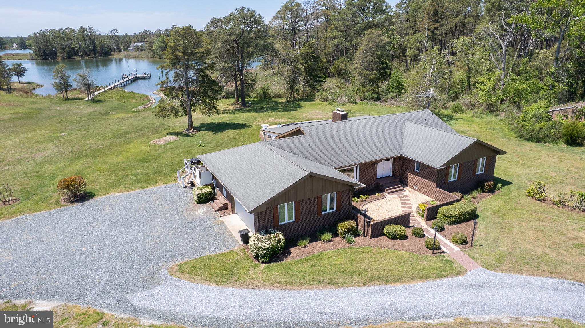 Welcome to a rare Eastern Shore offering where privacy, income potential, and waterfront lifestyle come together on 23± acres along the Little Choptank River. Currently a successful vacation rental, this property presents an exceptional opportunity for a second home that works for you—enjoy it when you want and generate income when you’re away.

The expansive acreage provides a peaceful, private setting with endless possibilities—gardening, small-scale farming, hunting, or enhancing the land with an impoundment or pond to attract waterfowl. The waterfront is fully equipped for enjoying life on the water with a partially rip-rapped shoreline, private pier and approximately 2.5 feet of mean low water depth—ideal for boating, fishing, and crabbing, with easy access to Fishing Creek and the Chesapeake Bay beyond.

Outdoor living truly shines with an in-ground pool overlooking the water, offering a serene setting for both quiet relaxation and entertaining. The spacious wooden deck provides ample room for dining and gatherings, while taking full advantage of the surrounding views. An outdoor shower adds a practical touch, making it easy to rinse off after time spent on the water or enjoying the outdoors.

The 4-bedroom, 3.5-bath residence is designed for comfort and gatherings, offering an open floor plan with two primary suites, each with private baths. The spacious kitchen is a true centerpiece, featuring a large island with breakfast bar, double wall ovens, cooktop, refrigerator, dishwasher, beverage refrigerator, and separate ice maker—fully equipped to handle everything from intimate dinners to large-scale entertaining. The adjacent dining room easily accommodates gatherings, while the family room, just off the kitchen, captures serene water views and opens to a spacious screened porch for seamless indoor-outdoor living. 

A sunroom adds additional living space, also overlooking the pool and waterfront, creating the perfect spot to unwind year-round. The home’s low-maintenance brick exterior, attached two-car garage with automatic opener, and thoughtful layout make it as practical as it is inviting.

Conveniently located approximately 2 hours from Washington, DC and 1.5 hours from Baltimore, this property offers the perfect escape without sacrificing accessibility.

Whether you’re seeking a private retreat, an income-producing investment, or a place to fully embrace the Eastern Shore lifestyle—boating, fishing, crabbing, kayaking, paddleboarding, and more—this property delivers.

Don’t miss the opportunity to own a truly unique waterfront estate with everything in place for summer enjoyment—schedule your private tour today and start living the lifestyle you’ve been waiting for.