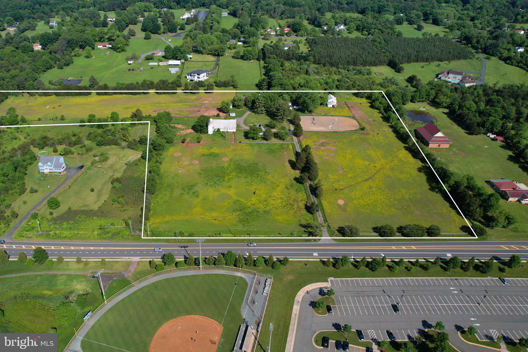 Exceptional opportunity to acquire a 20-acre farm with two homes and numerous outbuildings, ideally located across from top schools in Prince William County. The land holds significant value, having been approved for long-range use, allowing for potential subdivision.