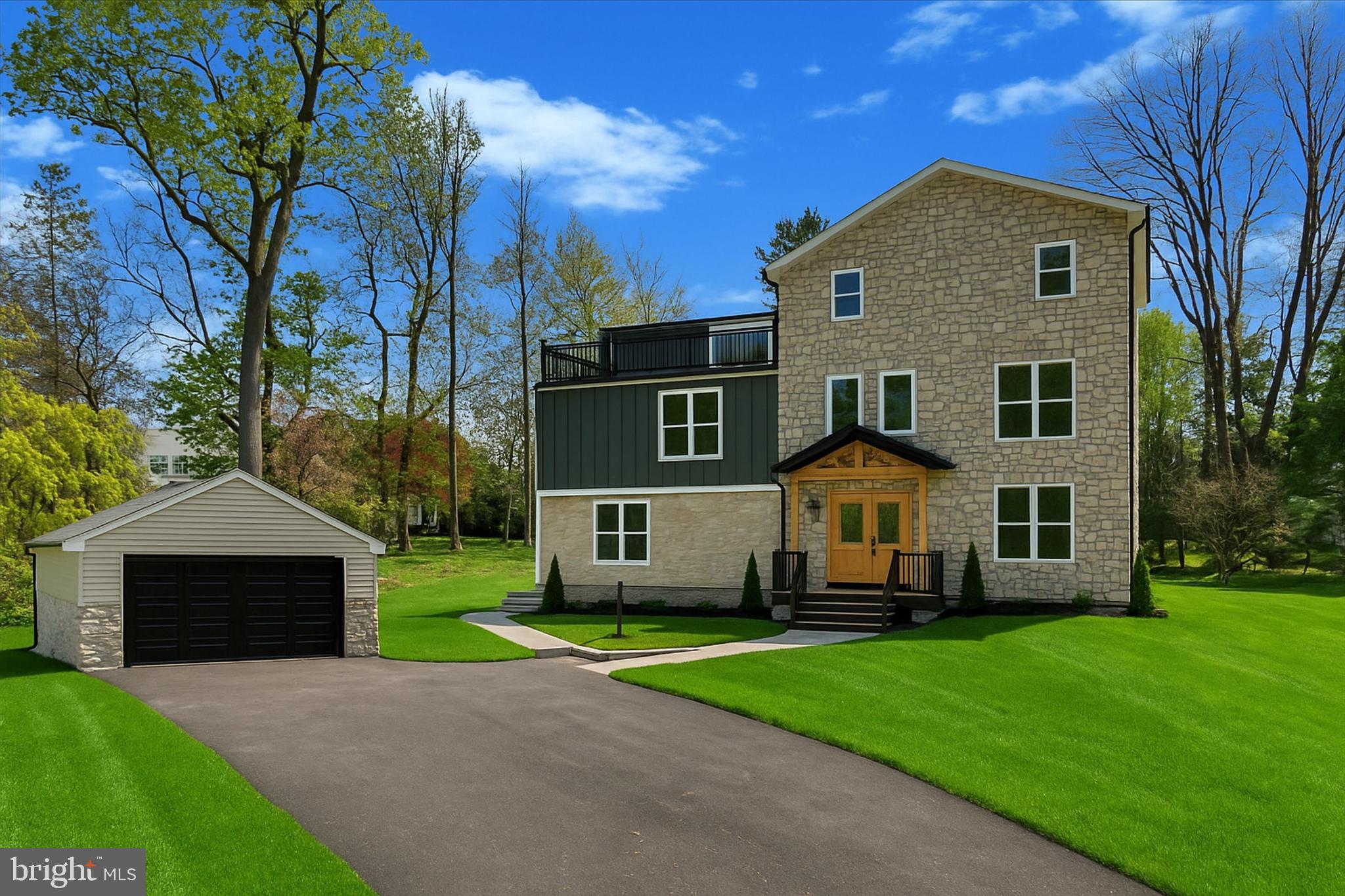 Sitting on nearly an acre, this new construction custom home blends modern luxury with timeless charm in the highly sought-after Lower Merion School District. The seller is offering an $8000 landscaping and landscaping lighting package, as well as a $8000 budget for appliances. Thoughtfully designed with top-tier materials and craftsmanship, this home offers both durability and elegance. Built for lasting quality, the home features Hardie siding and natural stone on the front, with CertainTeed vinyl siding on the sides and back. Viwinco double-hung windows enhance energy efficiency, while the new roof and gutter system includes a seepage bed for proper rainwater management. The home is equipped with a three-zoned forced-air HVAC system. Additional features include a gas tankless water heater for continuous hot water, brand new plumbing, and a brand new 200-amp electrical service. Step onto the welcoming front porch and into the foyer, where you'll immediately notice the stunning craftsmanship and natural light that fills the space. To the right, a formal dining room or flex space offers the perfect setting for memorable dinners or extra living space. Moving past the foyer, the spacious living room provides an inviting atmosphere for relaxation and boasts a gas fireplace. At the rear of the home, the chef’s kitchen features Fabuwood solid wood cabinets with dovetail drawers and soft-close doors, natural quartzite countertops, and a custom range hood. The kitchen also offers a 15 foot long and 9 foot high nano door system that opens all the way up into the back patio. A  butlers pantry, and a powder room with custom tile work complete the main level. Upstairs, the primary bedroom is a true retreat, featuring his-and-hers walk-in closets, a luxurious ensuite bathroom with a dual vanity, soaking tub, and massive shower, and a balcony that overlooks the backyard. A second bedroom includes an ensuite full bathroom as well, while two additional equally spacious bedrooms share a third full hallway bathroom. All bathrooms are finished with custom designer tile, Kohler toilets, and Delta faucets. A walk-in laundry room with hook-ups provides added convenience. The third level boasts a substantial den or secondary living room area. Another bedroom, that could also be used as a home office or den, has its' own ensuite bathroom as well. This level also offers a large walk-out balcony, providing additional outdoor space and stunning views. The home is designed for both beauty and function, featuring two walk-out balconies with black metal railings and composite decking, which require no upkeep. The large backyard is a blank canvas, ready to be transformed into a private outdoor oasis. The basement houses all mechanicals, includes a French drain and two sump pumps, and features an epoxy-coated floor for easy cleaning. Additional highlights include: shaker-style custom doors and trim supplied by Freedom Millwork; LED recessed lighting and designer fixtures throughout; decora switches and outlets, plus under-cabinet lighting in the kitchen; a walk-in butler’s pantry with custom cabinetry, shelving, a prep sink, and butcher block countertops; and Sonos wireless speaker system for indoor and outdoor entertainment. Located in the heart of the Main Line, this home is just minutes from Villanova University, the newly constructed Black Rock Middle School, and the charming towns of Bryn Mawr, Wayne, West Conshohocken, and King of Prussia. With easy access to Route 76, 476, Center City Philadelphia, and the airport, this location offers convenience without compromising on space or privacy. This remarkable home is built for modern living, offering timeless design, premium finishes, and unparalleled comfort!