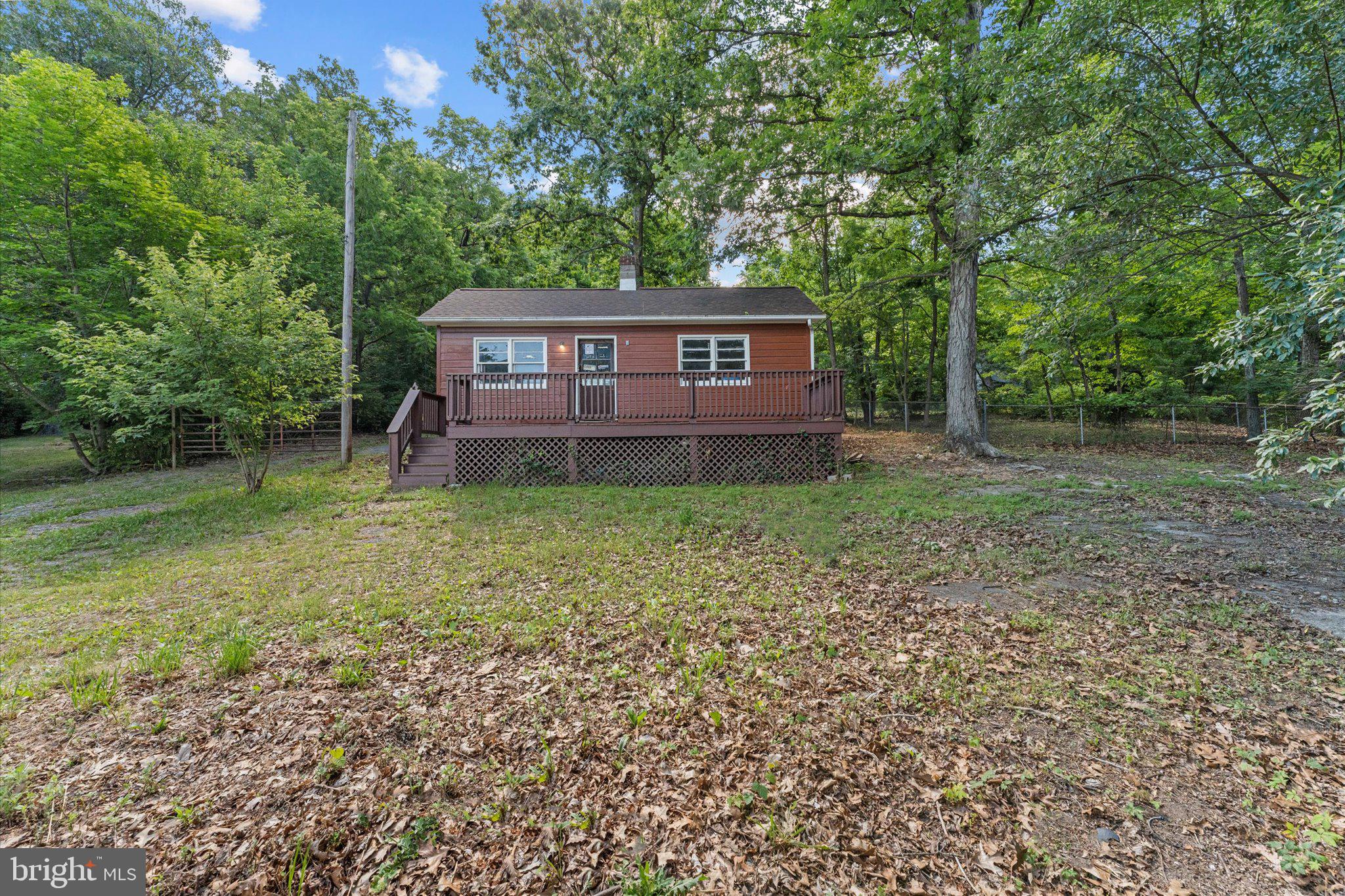 Calling investors and outdoors enthusiasts: This property is close to town with a large shop, and a potential small home after renovations! 

The vacant home is in need of love and repairs, but has electric, water from a private well, and a permitted septic rated for 2 bedrooms. 

The large shop has electric and an adjacent H2O hydrant, as well as a loft for extra space.

Backing up to quiet woodlands, this property provides ample privacy and hunting/shooting opportunities.

Property is being sold as-is, where-is.