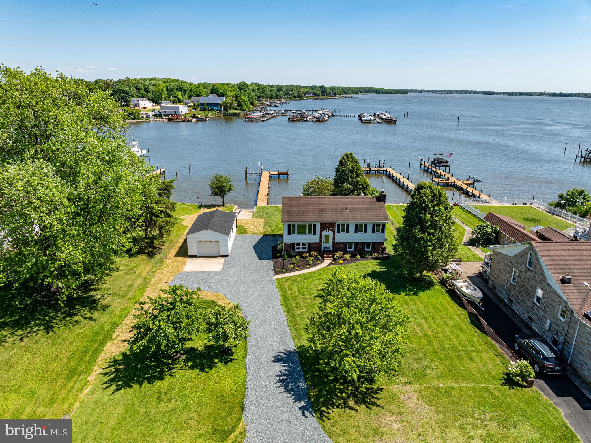 PRICE IMPROVEMENT!! Motivated sellers! 

Welcome to 1524 Galena Road, a rare waterfront gem in Essex featuring 100 feet of water frontage and a private pier with a working boat lift—perfect for boaters and water enthusiasts. Nestled on a double lot, this 4-bedroom, 2-bathroom home has been thoughtfully updated in 2024, blending modern upgrades with timeless charm.

Inside, you'll find brand-new flooring throughout, including tile, engineered hardwood, and plush carpet, with original hardwood floors preserved under the carpet on the second level. The main-level kitchen boasts granite countertops and stainless steel appliances, while a second kitchen adds flexibility—ideal for hosting guests or additional convenience.

Step outside to soak in the scenic water views, relax on the garage porch overlooking the waterfront, or take a short stroll to the community beach. The home also features solar panels for energy efficiency, helping reduce utility costs.

This incredible waterfront opportunity is strictly sold as-is. Schedule your showing today—motivated sellers are ready to make a deal!

Please note: Outdoor video and audio recording devices are in use.