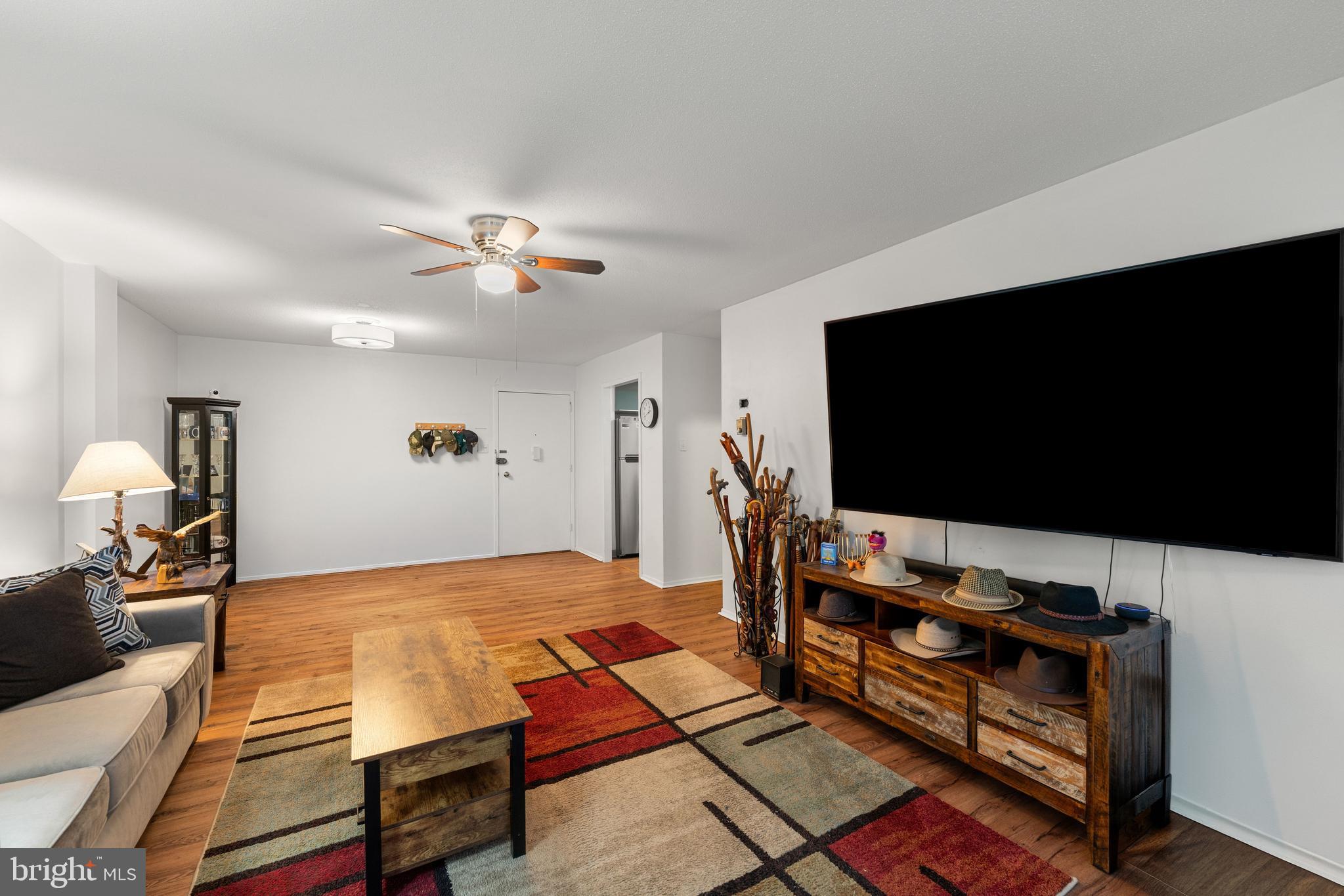 Welcome home to Unit 301S at the prestigious Beaver Hill Condominiums! This beautifully updated 1 bed/1 bath condo perfectly blends modern renovations with full service building living. The completely renovated kitchen shines with high-gloss teal cabinetry, butcher block countertops, an industrial-style faucet, and a full suite of stainless steel appliances including a gas range, dishwasher, and refrigerator. The spacious living room flows onto a private curved balcony with lovely treetop views, while warm hardwood style flooring runs throughout. The generous bedroom features a ceiling fan, built-in shelving, and a large walk-in closet. The full bathroom offers a clean, updated vanity. Building amenities include utility coverage, a stunning outdoor pool, a separate wading pool set amid lush landscaping, and a grand attended lobby with 24 hour concierge service.  Move-in ready, schedule your showing today!