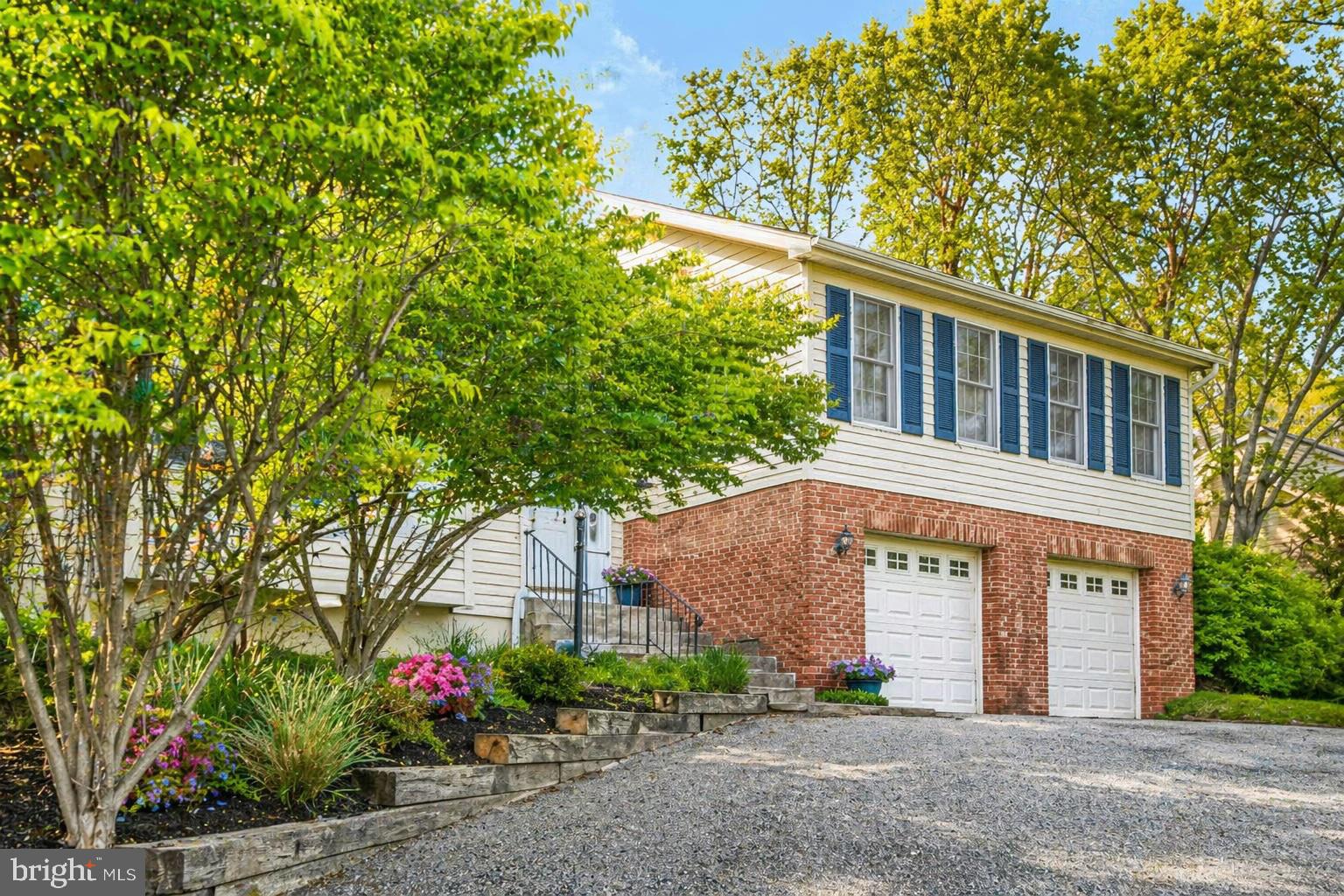 Once upon a time, in the heart of Hunt Ridge, there was a house waiting for its next chapter to unfold.

From the outside, it feels classic and familiar, set along one of those gorgeous, tree-lined streets where evening walks and morning jogs become part of the daily rhythm. But step inside, and the story shifts. This is a home that has been thoughtfully refreshed and reimagined, ready for what comes next.

The space unfolds in a way that just makes sense. Just off the main foyer, the living room welcomes you in with vaulted ceilings and a working fireplace—the kind of space that feels just right for quiet evenings or gathering with friends.

A few steps away, the dining room and kitchen come together as the natural center of the home, making everyday living easy and entertaining feel effortless, flowing right into the family room where everyone tends to end up. It’s easy to picture mornings in the kitchen, casual meals within reach, and evenings in the dining room that stretch a little longer—friends gathered around the table, conversation lingering well past dinner.

Tucked privately away from the main living spaces is the home’s “sleeping wing,” where the bedrooms are thoughtfully laid out. The primary suite feels like a true retreat, with room for a king-sized bed, a refreshed and oversized bathroom, and a walk-in closet that functions the way you need it to. Three additional bedrooms are generously sized with great closet space, all served by an updated hall bathroom that feels fresh and move-in ready.

Light pours in throughout the home, shifting beautifully from front to back. The front bedrooms feel bright and welcoming, while along the rear of the home, windows and sliding glass doors in both the family room and the primary suite open to views of a backyard framed by mature plantings and stacked stone walls, creating a quiet, private setting.

The lower level adds another layer of flexibility, with a full family room that gives you options, whether it’s movie nights, a playroom, or simply a place to spread out.

When the weather turns warm, life moves easily outdoors. The expanded deck, accessible from both the family room and the primary bedroom, becomes an extension of the home, perfect for morning coffee, summer dinners, or a quiet moment at the end of the day.

Practical details have been thoughtfully addressed throughout, including a newer HVAC system (2019), a recently replaced washer and dryer, new recessed lighting, and a new cedar fence that enhances both privacy and outdoor enjoyment, along with many additional updates that make the home feel truly move-in ready.

All of this in Hunt Ridge, a neighborhood known for its convenience to I-695 and I-83, while still offering a sense of calm and connection. The community association helps maintain the neighborhood’s character and brings neighbors together with events throughout the year, adding another layer to what makes this area so special.

This is a home that feels fresh, welcoming, and ready, where everyday living is easy, and where it’s not hard to imagine your life unfolding next.