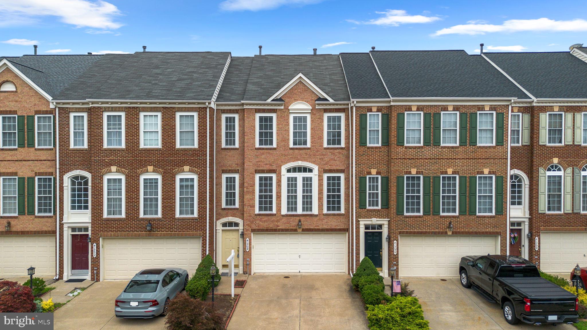 Wow!  New paint, new carpet and new floor! The house feels like new!  This beautiful brick front 2 car garage  townhome in sought-after Kirkpatrick Farms featuring 3 bedroom, 2 full bathroom and 2 half bathroom. The bright country kitchen offers ample cabinet space, a center island, and room for casual dining overlook large deck with a fence back yard. The open living and dining area is highlighted by a stunning three-sided gas fireplace, creating a warm and inviting atmosphere.  The generous primary suite features a vaulted ceiling and a walk-in closet. The fully finished walk-out lower level includes a convenient half bath and provides excellent additional living or entertainment.  Excellent location close to schools, pool and shopping area.   
Please remove shoes or use shoe covers.  Thank you!