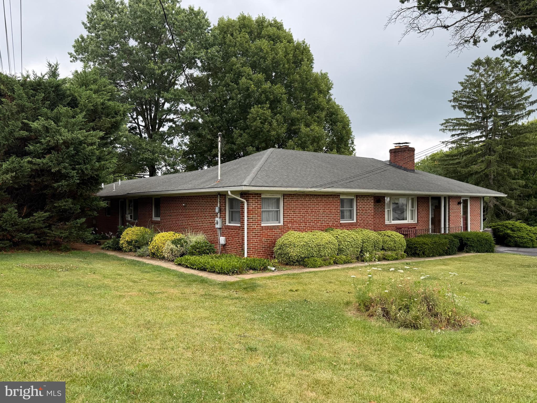 Welcome to 3 Culwell Dr. in Mount Airy! This well-maintained, four-sided brick home is move-in ready and offers comfort, flexibility, and exceptional potential. The main level features three generously sized bedrooms, two full bathrooms, beautiful hardwood floors, and a spacious eat-in kitchen with abundant counter and cabinet space. Enjoy cozy evenings by the wood-burning stove in the family room or relax in the formal living room with its classic fireplace.

The fully finished lower level provides an expansive recreation area that's perfect for entertaining, family gatherings, or a game room, along with a dedicated laundry room for added convenience. A large deck off the back of the house is perfect for grilling and outside entertainment, and overlooks a spacious and private backyard. 

One of the property's standout features is the separate addition, offering outstanding versatility. Currently configured as a private one-bedroom apartment complete with its own living room, kitchen, full bathroom, and two private exterior entrances, the space has no interior access to the main house. It presents an excellent opportunity for rental income, multigenerational living, or guest accommodations.

The property is zoned NP (Neighborhood Professional), allowing for additional possibilities such as a professional office for an accountant, attorney, or other approved business use, making this a unique investment opportunity.

Conveniently located just minutes from downtown Mount Airy, this property combines a desirable location with flexibility rarely found in today's market. Schedule your showing today and discover all the possibilities this exceptional home has to offer.